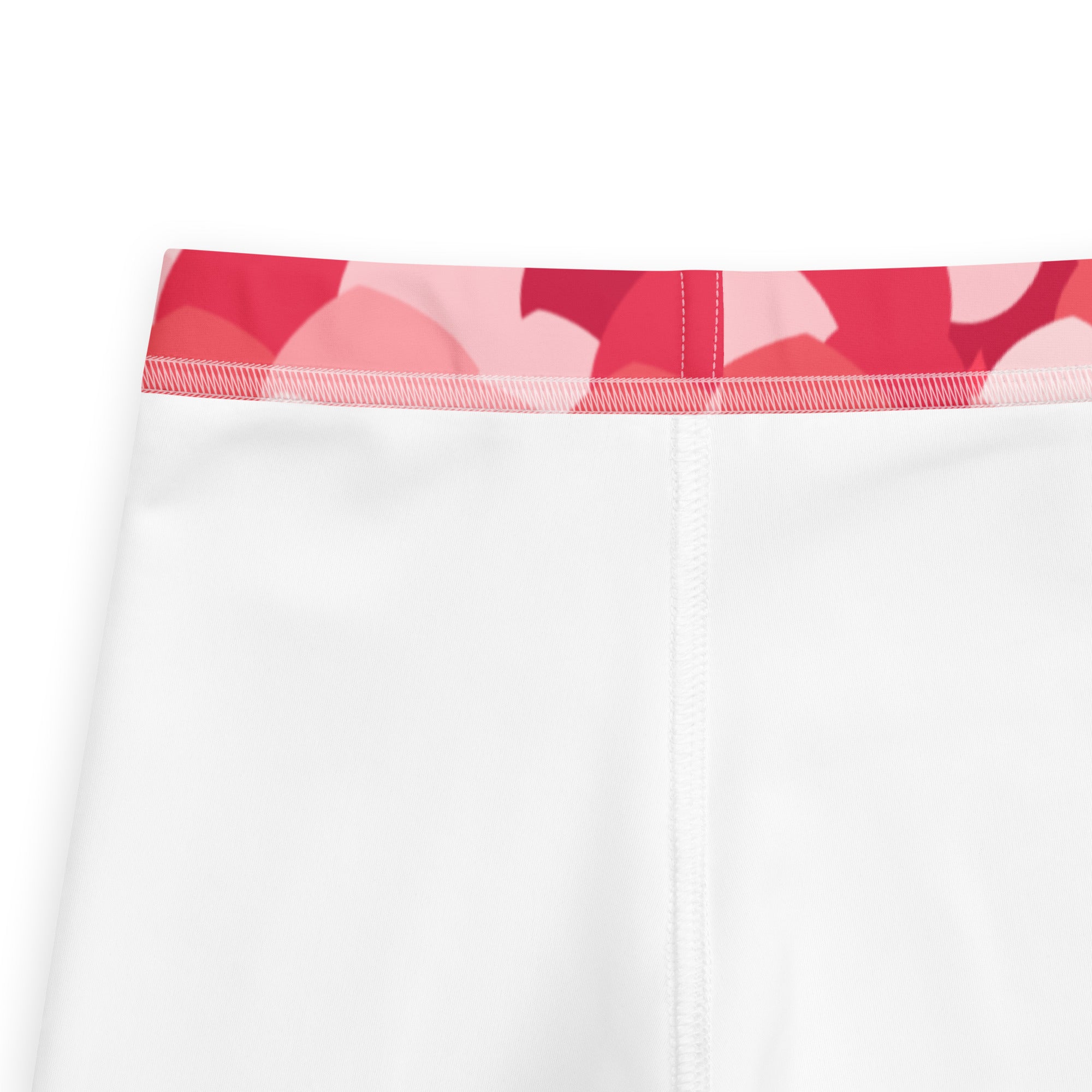 Girls pink heart cloud leggings with buttery soft white fabric and a red and pink abstract patterned waistband