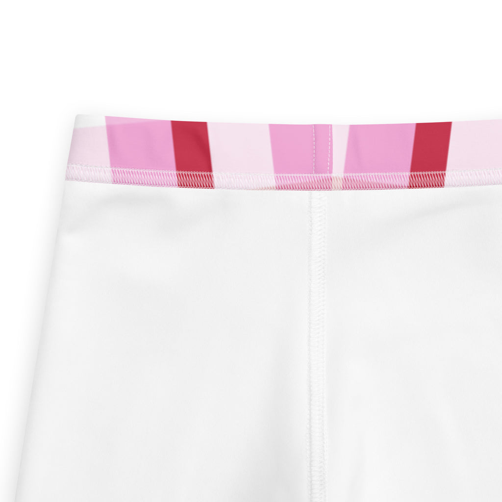 White girls leggings with buttery soft fabric and colorful pink and red striped waistband for everyday wear