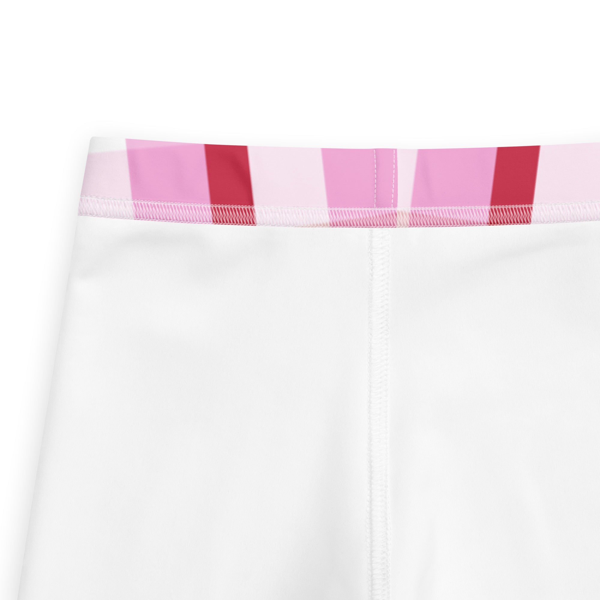 White girls leggings with buttery soft fabric and colorful pink and red striped waistband for everyday wear