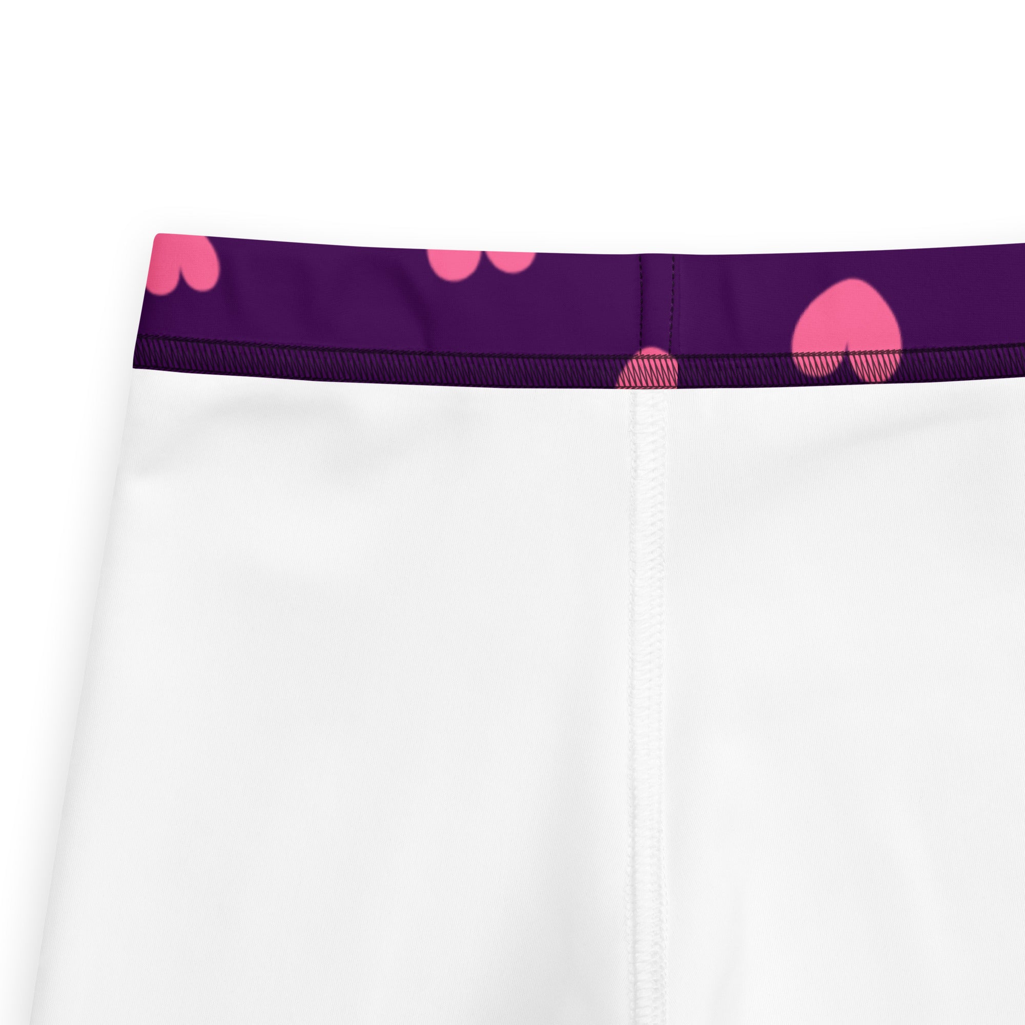 White girls leggings with a purple waistband and pink heart patterns made from buttery soft fabric