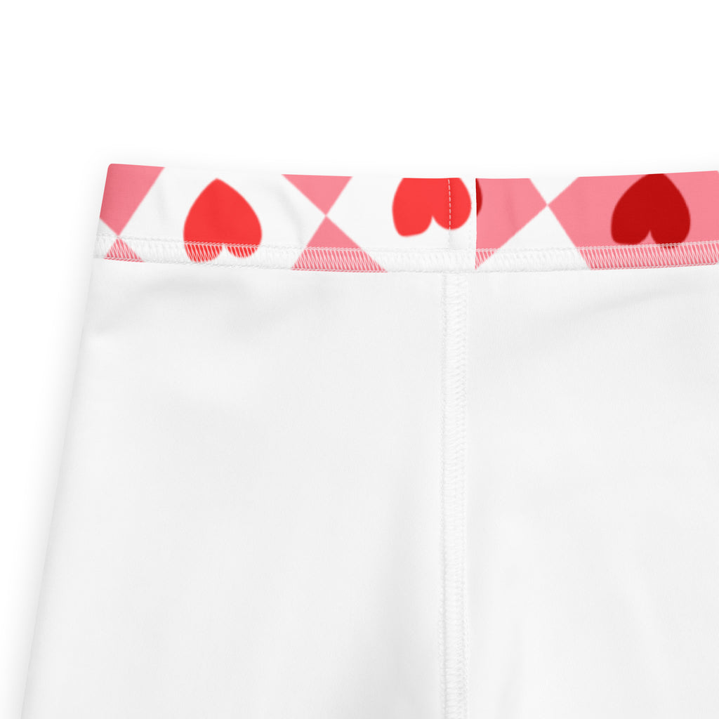 White girls pink argyle heart leggings with playful red hearts and pink geometric waistband buttery soft material