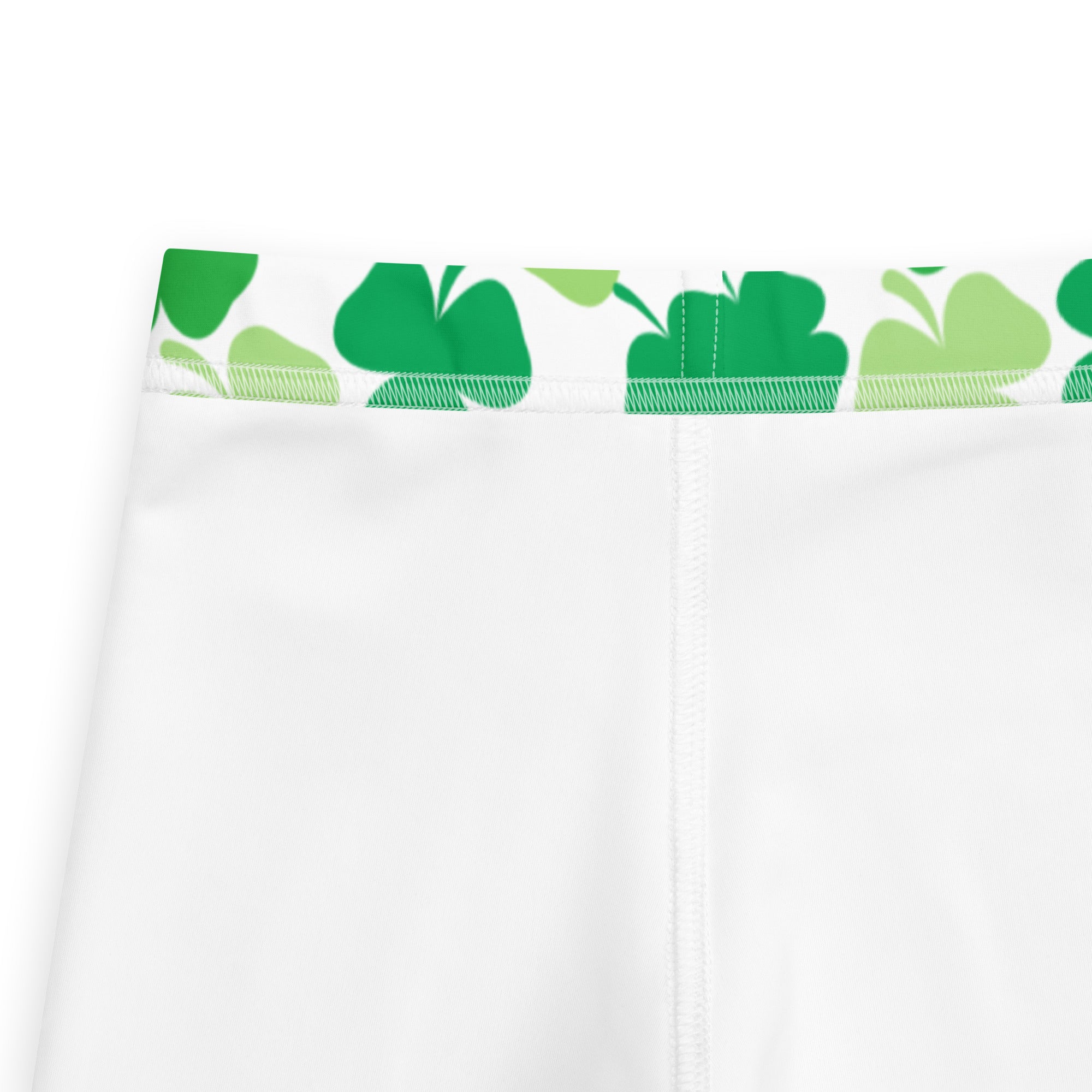 White athletic shorts with a green shamrock patterned waistband from girls green shamrock buttery soft leggings