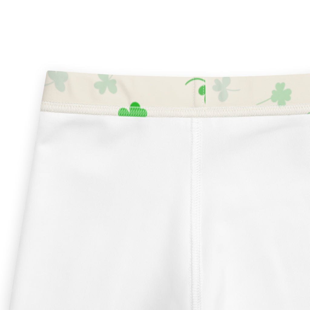 Girls shamrock buttery soft leggings with white shorts and beige elastic waistband featuring green shamrocks