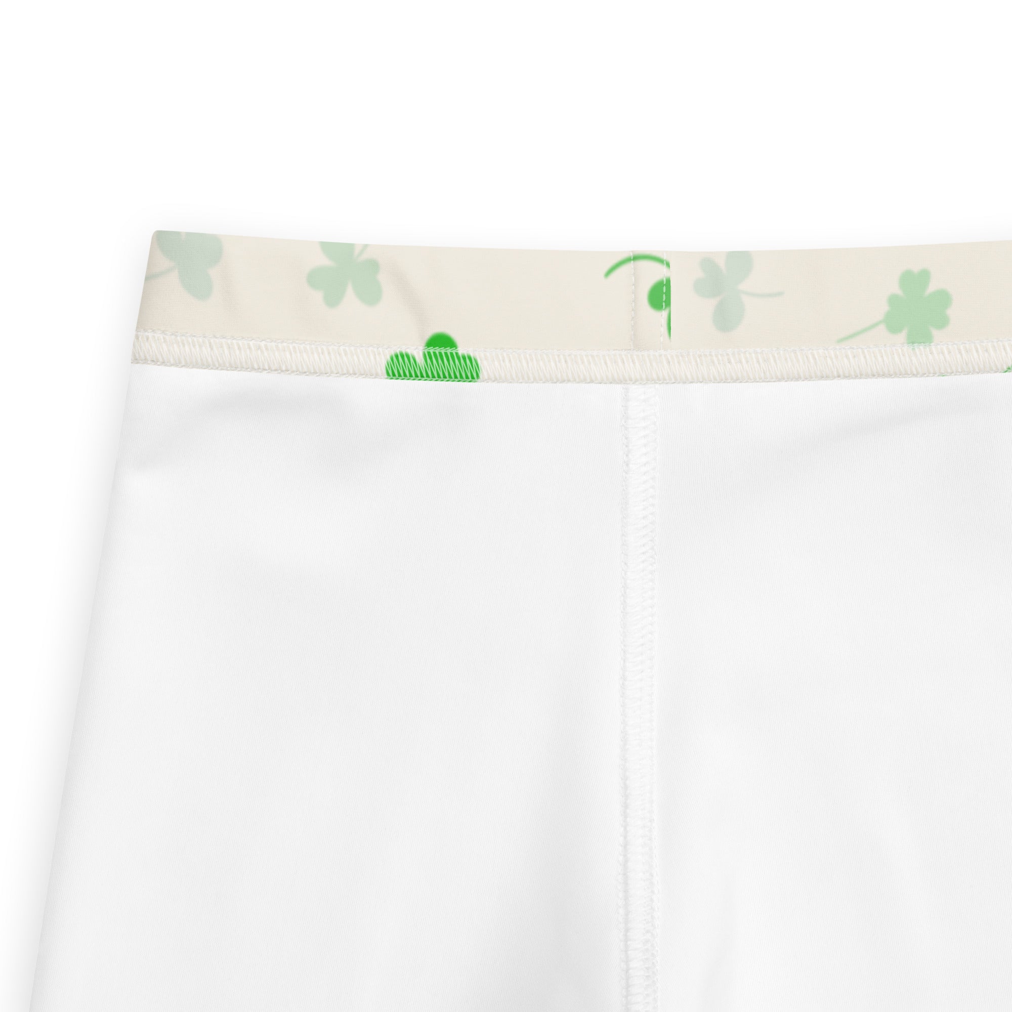 Girls shamrock buttery soft leggings with white shorts and beige elastic waistband featuring green shamrocks