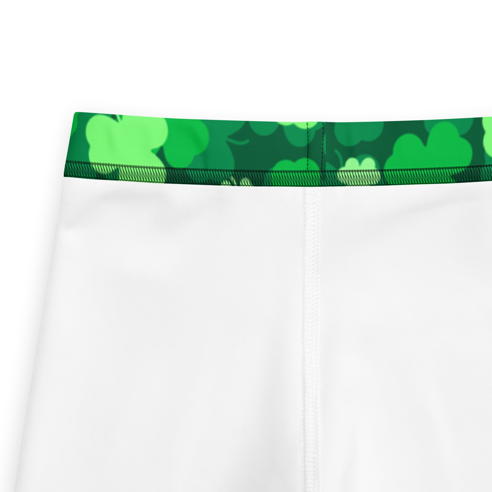Girls emerald green shamrock buttery soft leggings featuring white athletic shorts with a green shamrock waistband