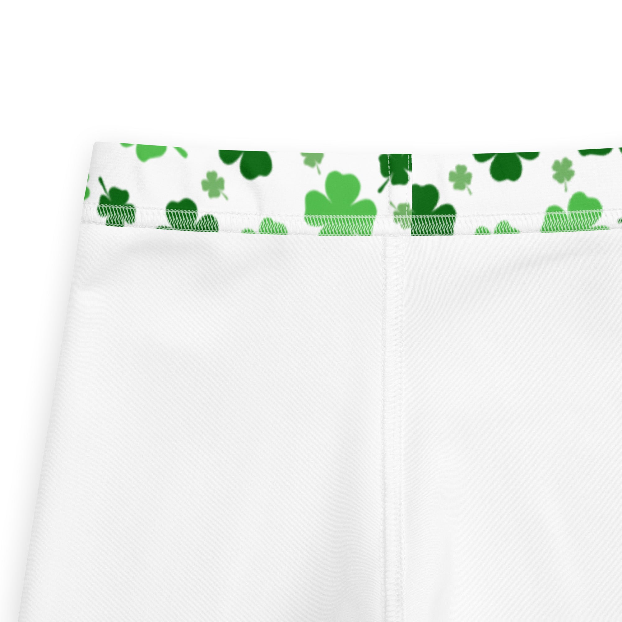 White girls buttery soft leggings with green shamrock print on waistband and white pants design