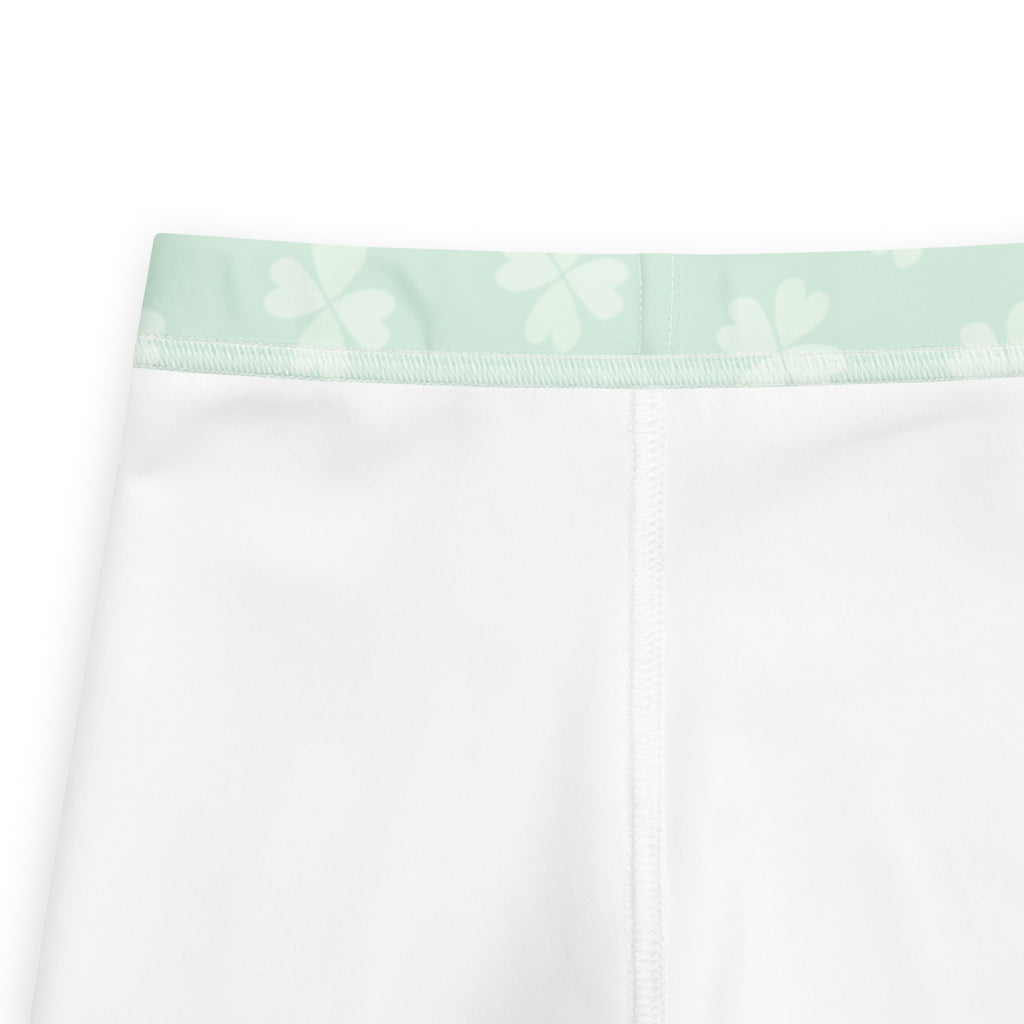 Girls mint shamrock buttery soft white leggings with a mint green waistband and subtle white shamrock patterns