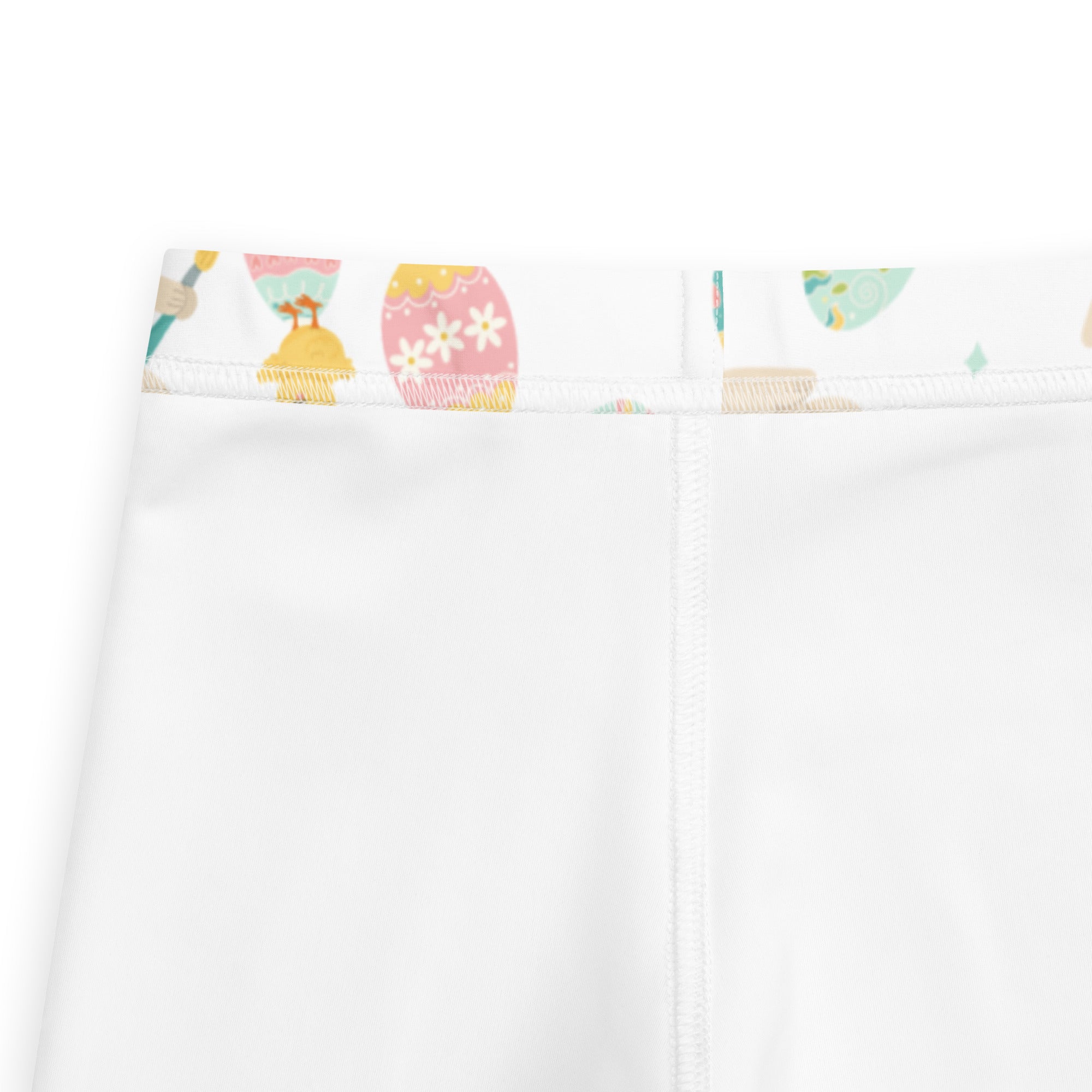 White girls buttery soft leggings with colorful easter-themed waistband featuring decorated eggs and dresses