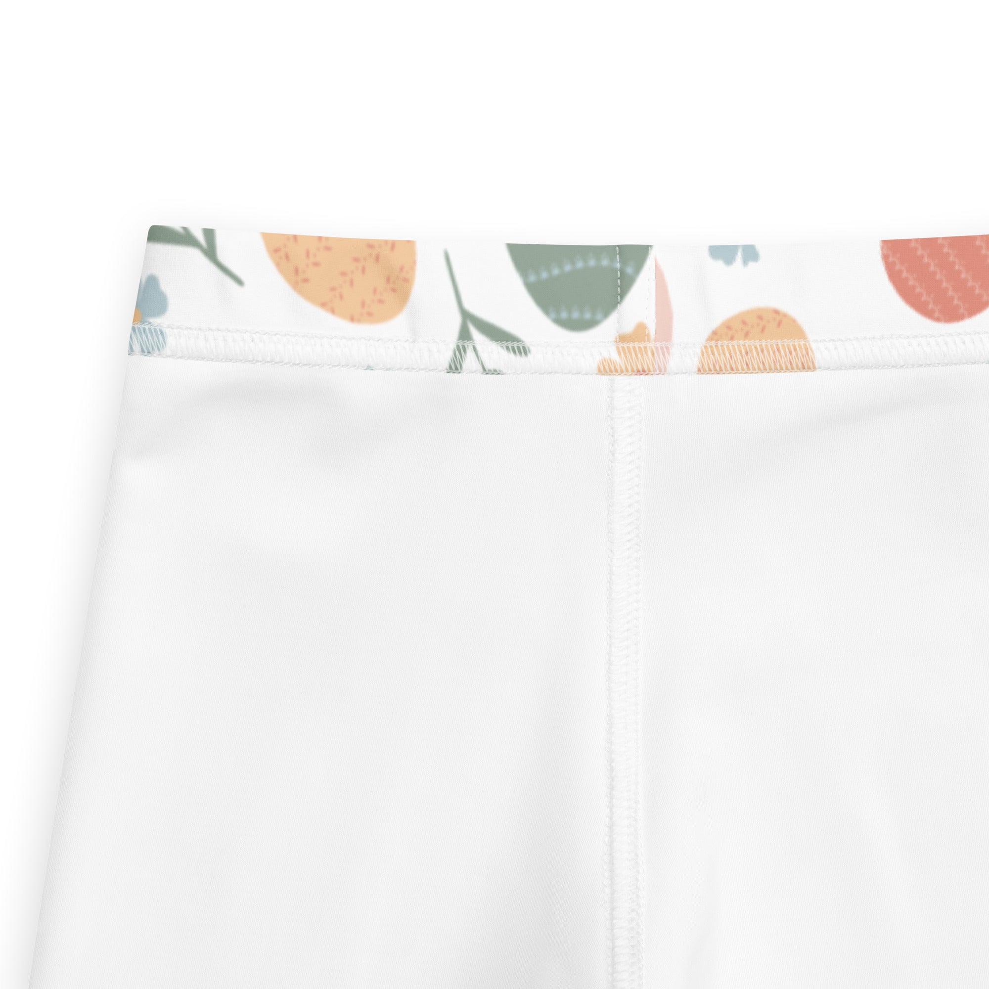 Girls floral Easter egg buttery soft white leggings with playful illustrated waistband of abstract fruit and leaves