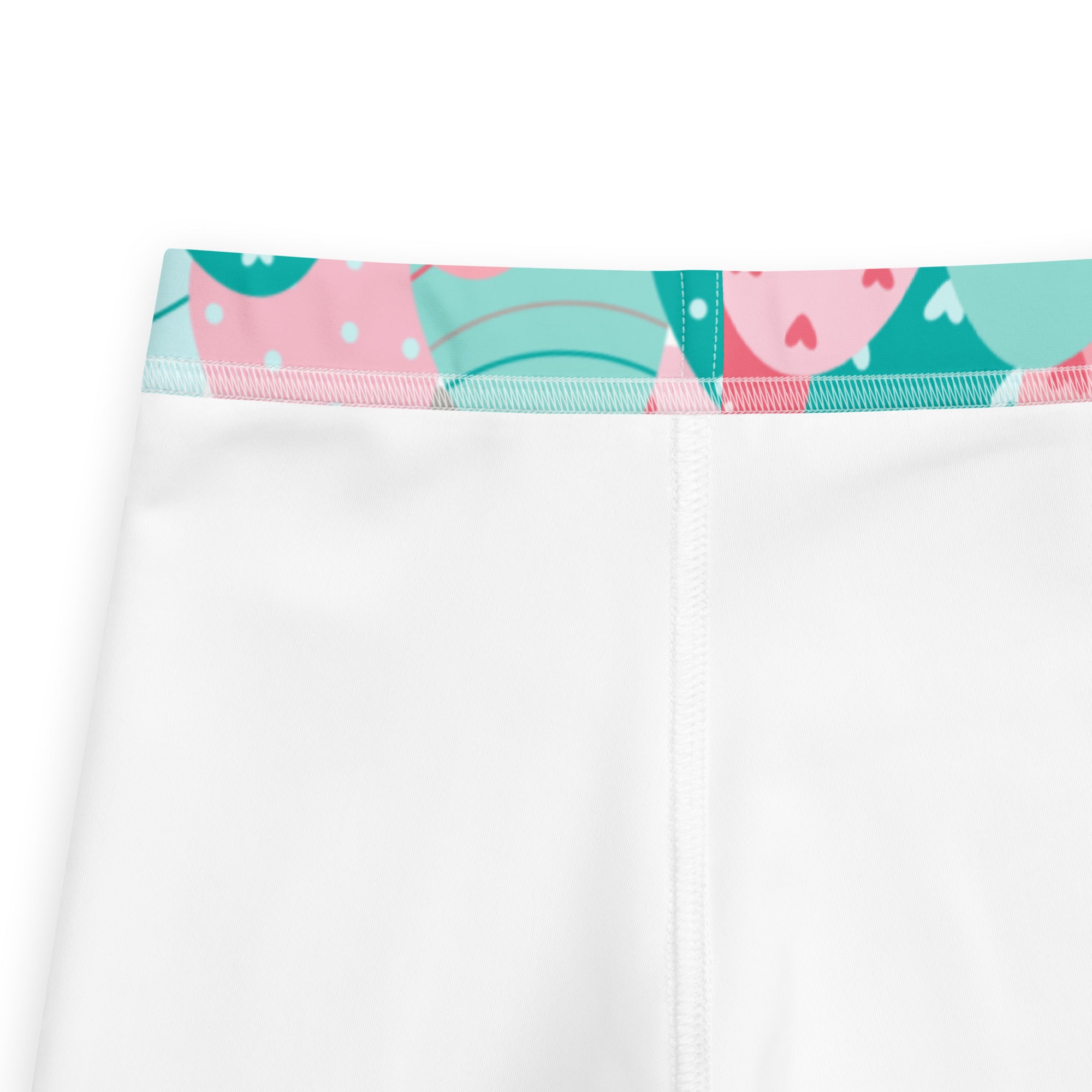Girls pink and teal easter eggs buttery soft white leggings with colorful cartoon waistband featuring pink and teal shapes