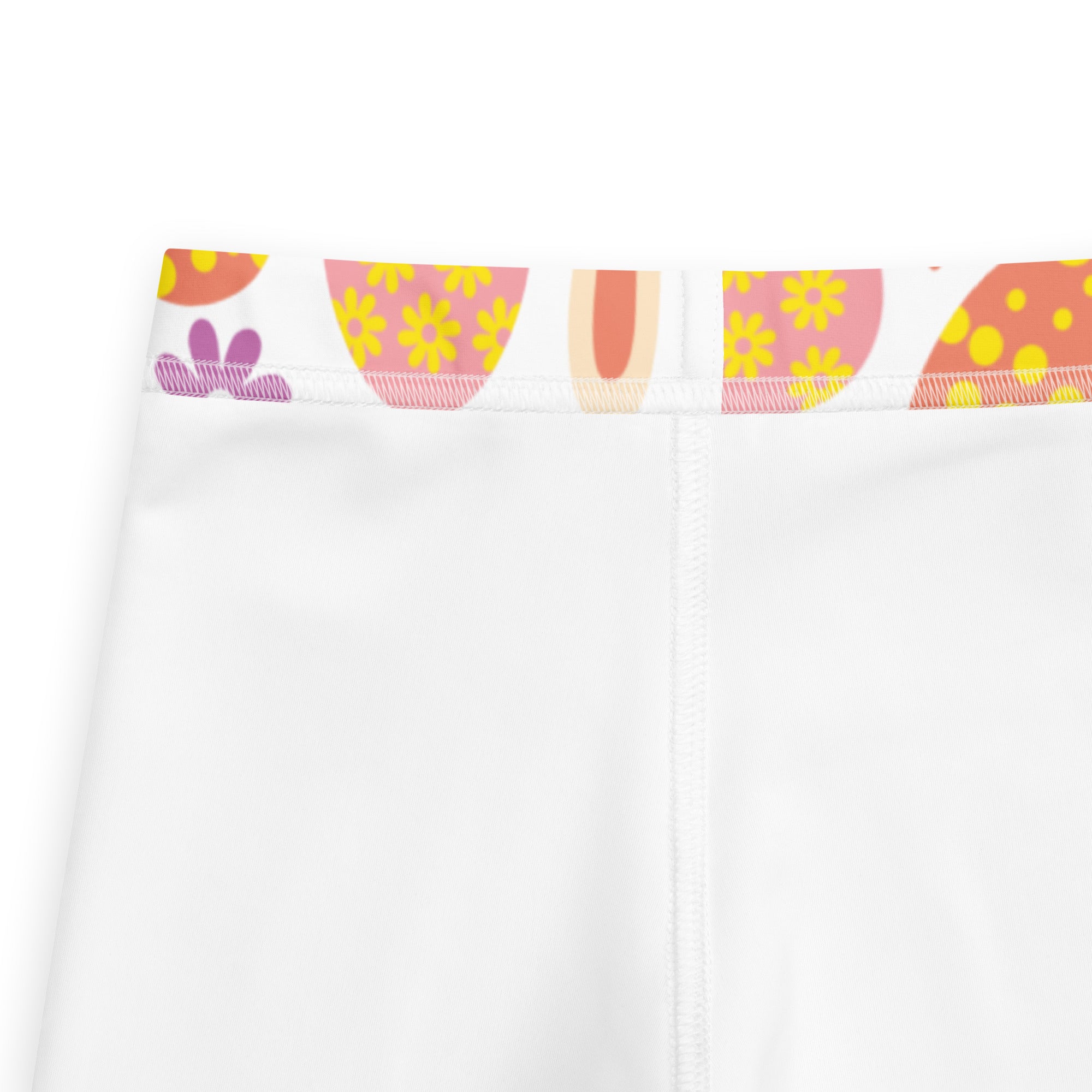 Girls orange bunny Easter egg buttery soft white leggings with colorful yellow flower waistband on pink and orange backgrounds