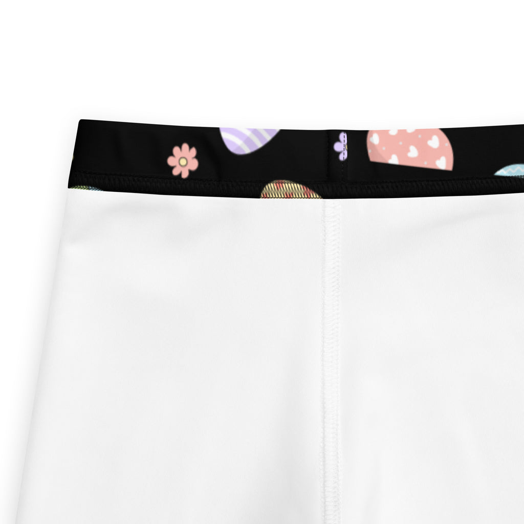 White girls rainbow easter eggs buttery soft leggings with black waistband and pastel flower and shape pattern