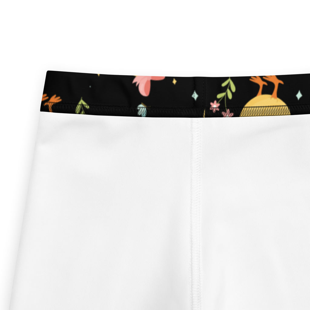 White girls shorts with black waistband and colorful cartoon birds flowers and stars in soft fabric for easter wear