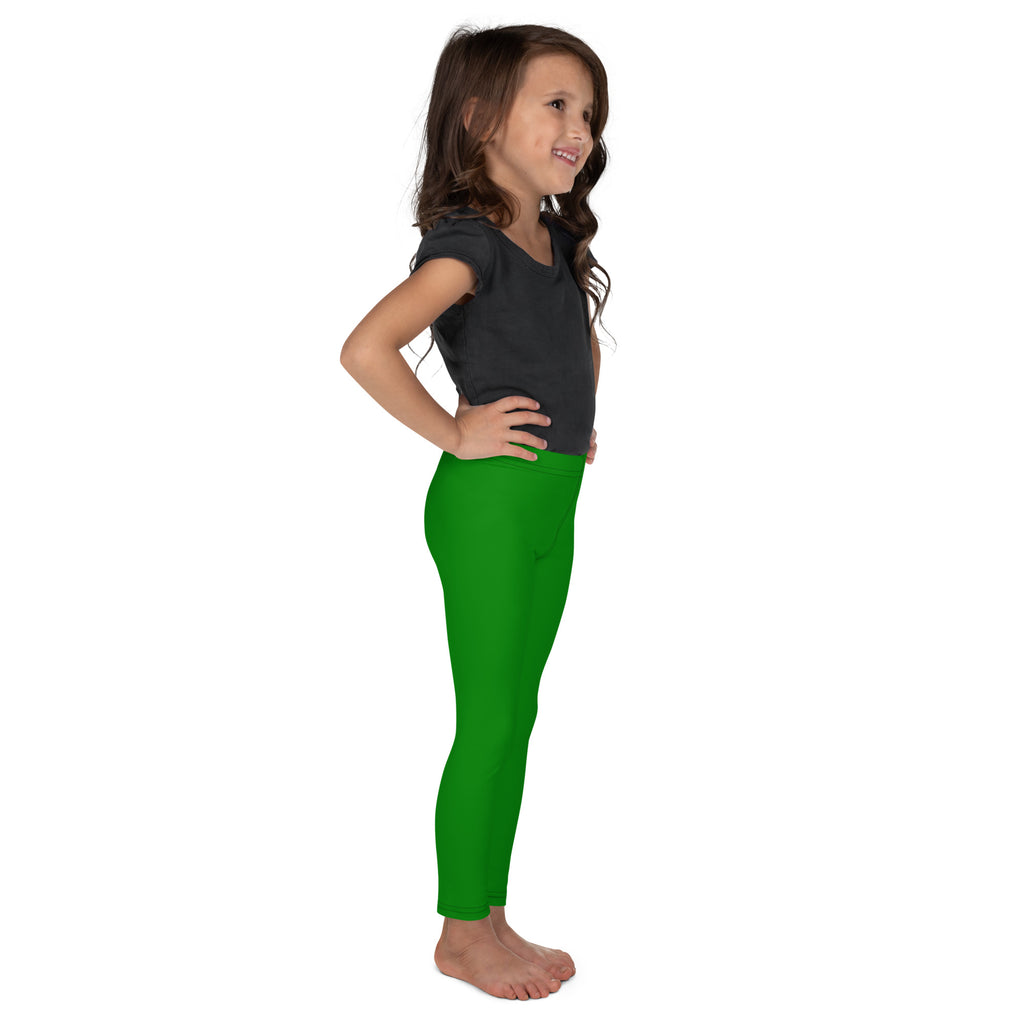 Bright green buttery soft kids leggings worn by a young girl showing a form-fitting comfortable fit