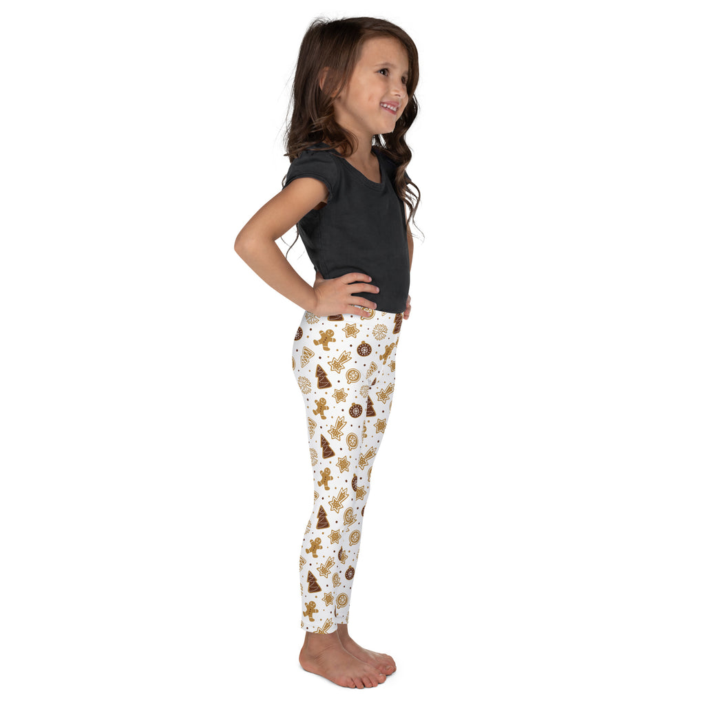 Kids gingerbread christmas leggings in white buttery soft fabric with festive brown and gold gingerbread men and trees pattern