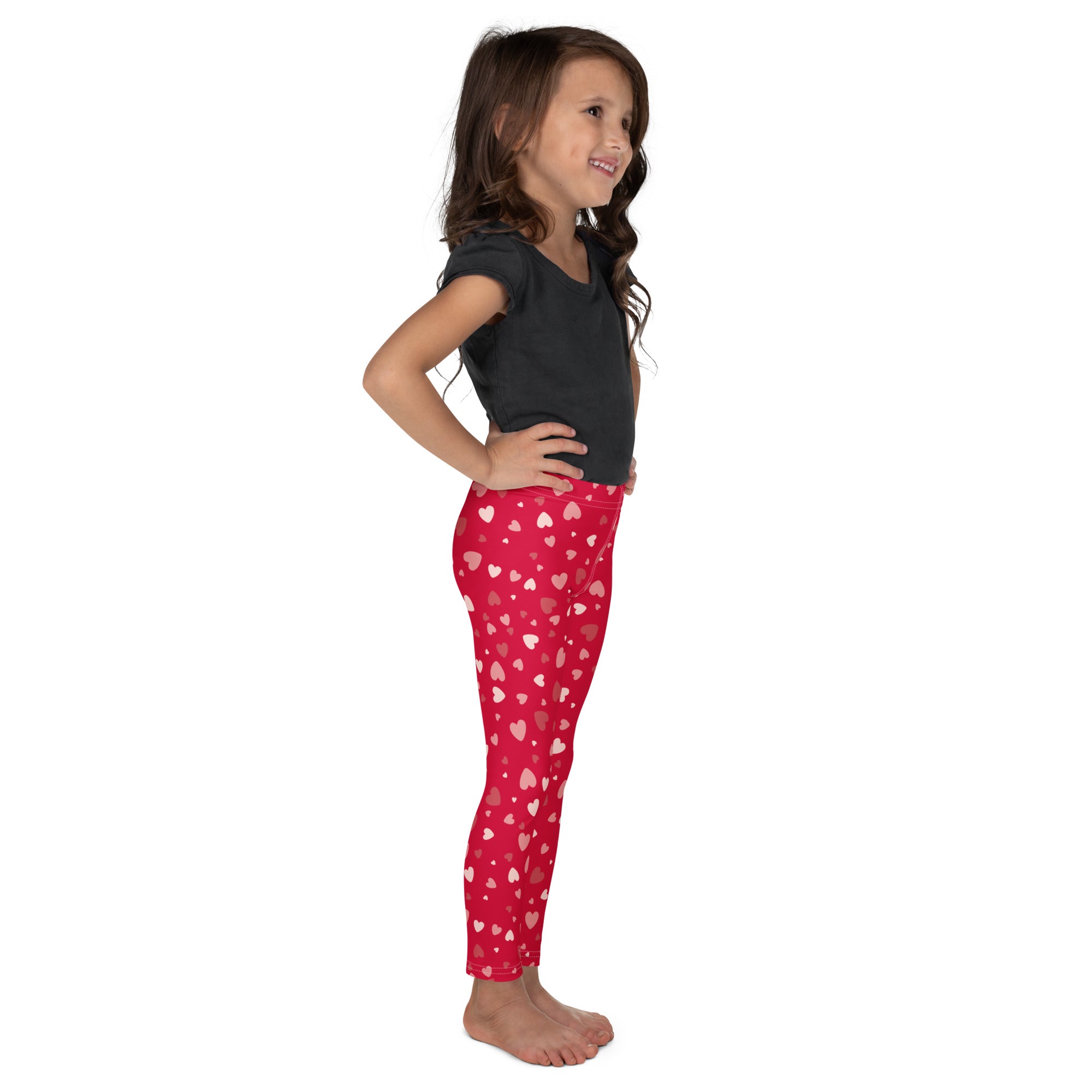 Girls red heart print buttery soft leggings featuring stretchy form-fitting red heart-patterned design