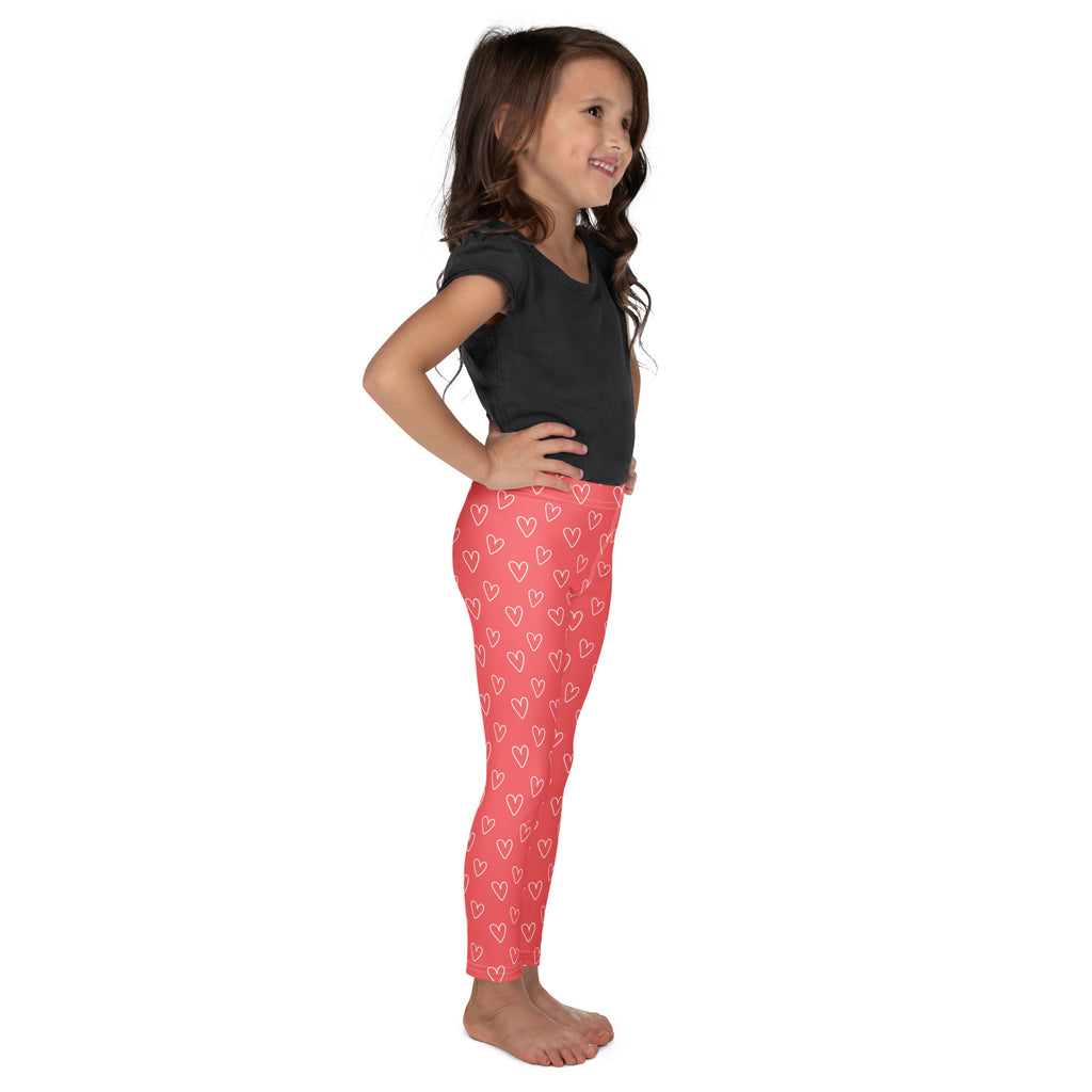 Girls pink buttery soft leggings with white heart outline pattern perfect for everyday wear
