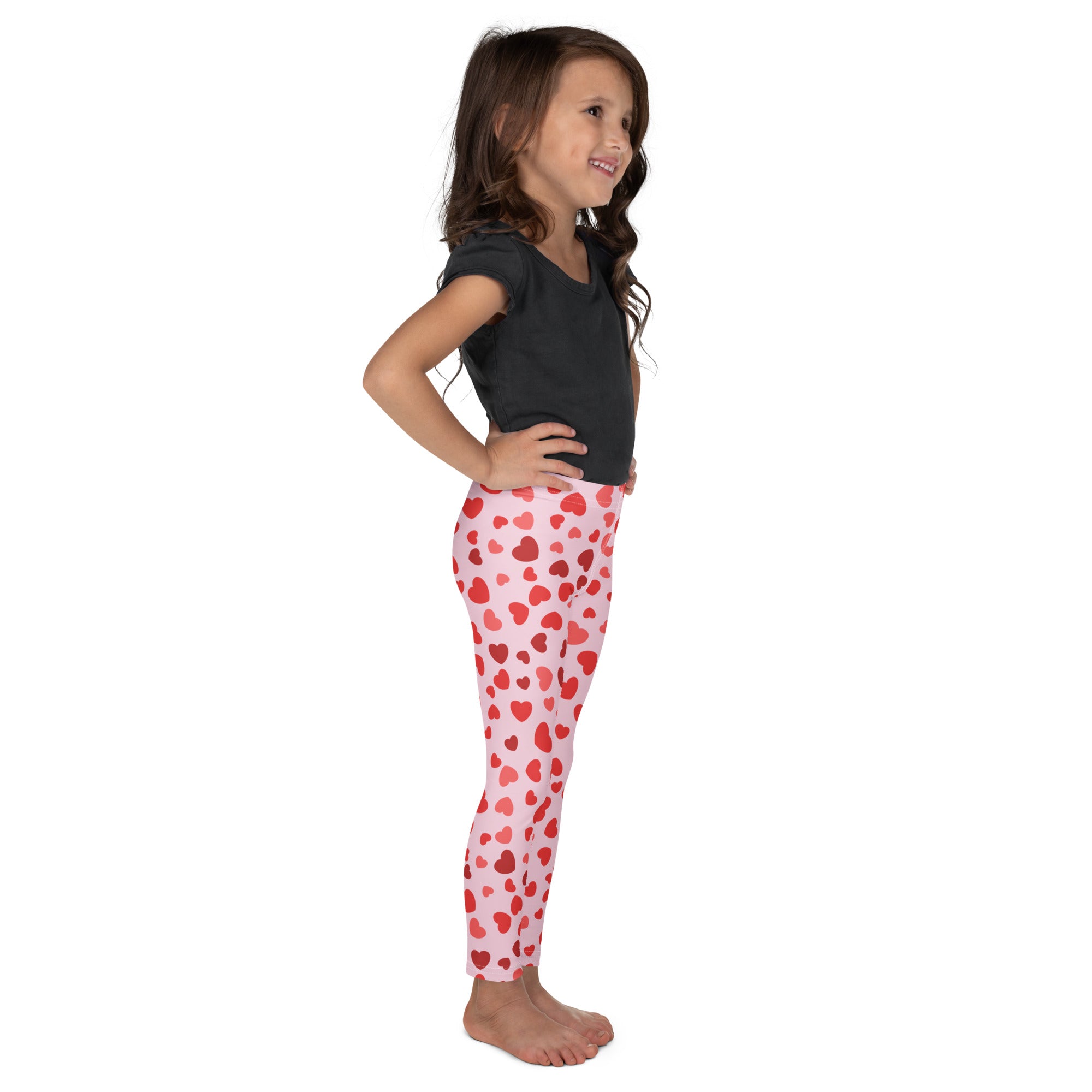 Girls Valentine’s Day pink heart buttery soft leggings with red heart pattern perfect for festive wear