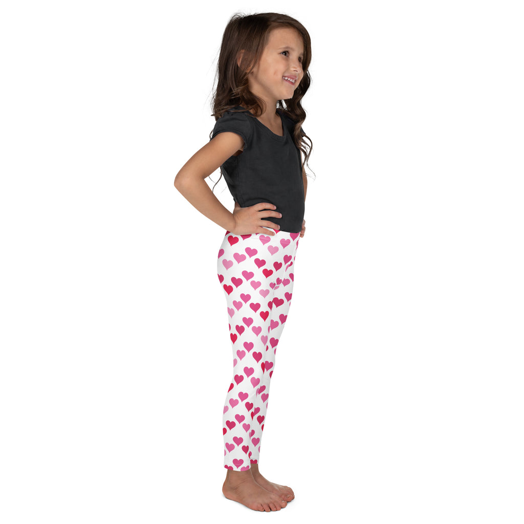 Girls Valentine’s Day white buttery soft leggings with pink heart pattern in varying shades for festive wear