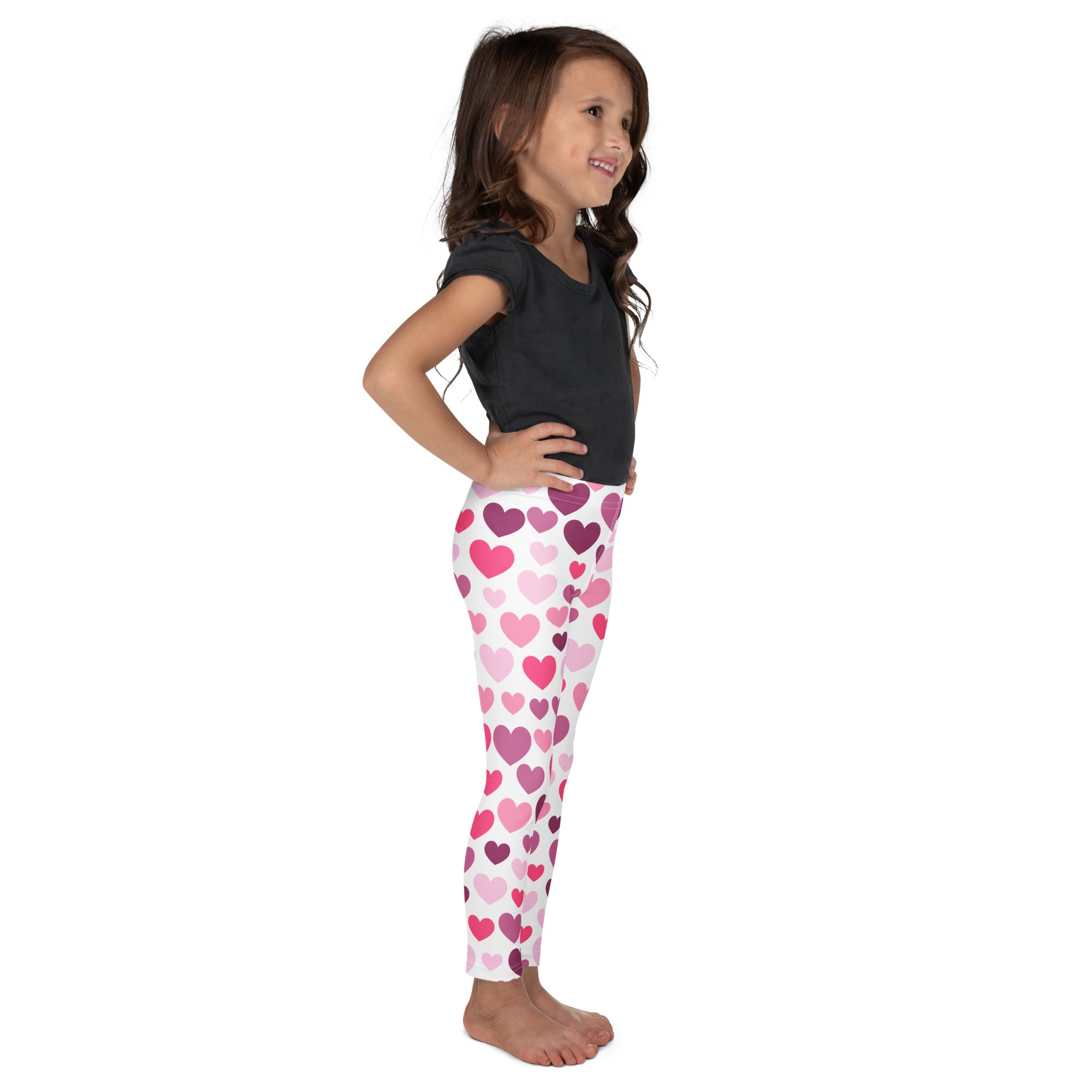 Girls purple and pink hearts buttery soft white leggings with playful heart pattern in shades of pink and purple