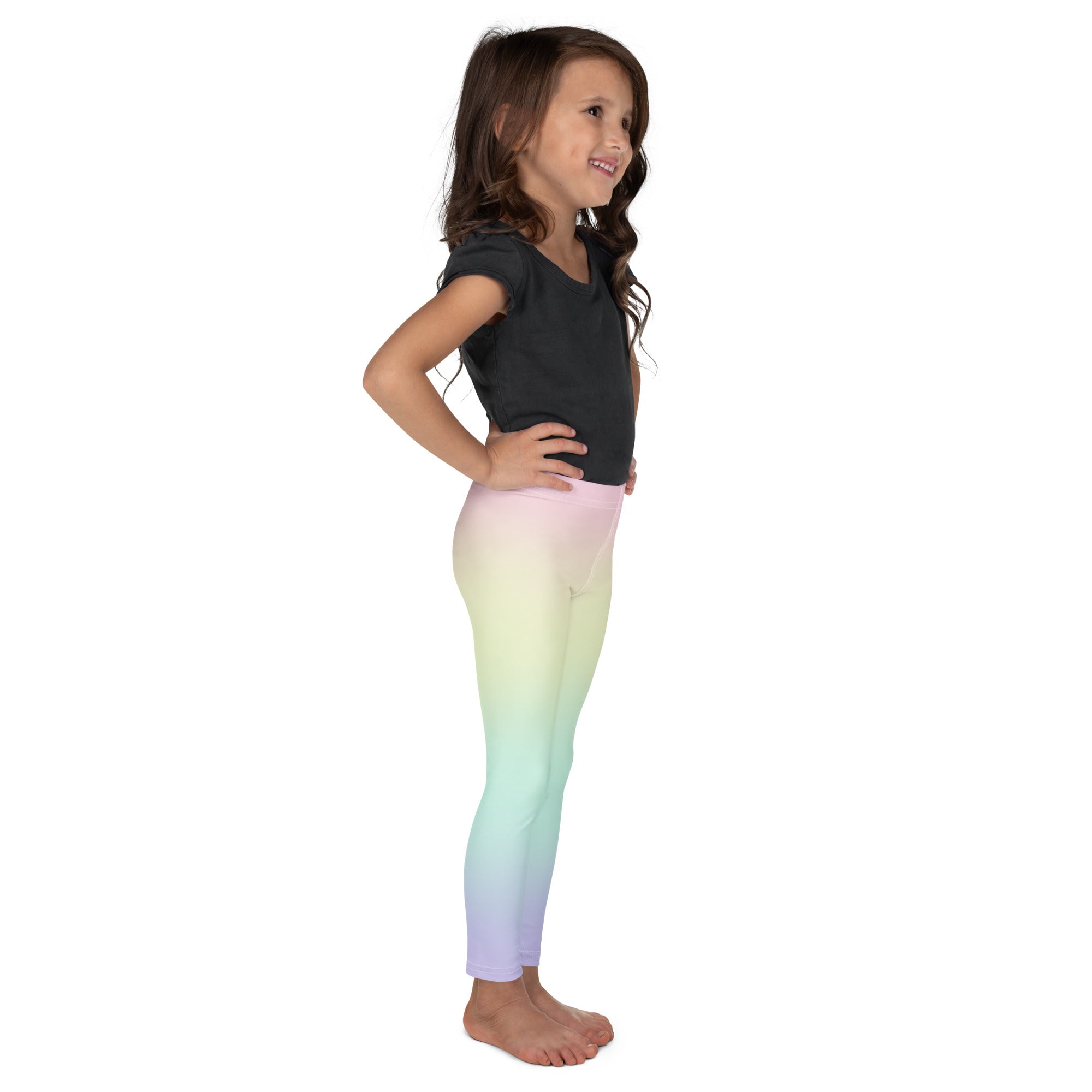 Girls pastel rainbow buttery soft leggings featuring a pastel gradient blend of pink yellow green and lavender hues