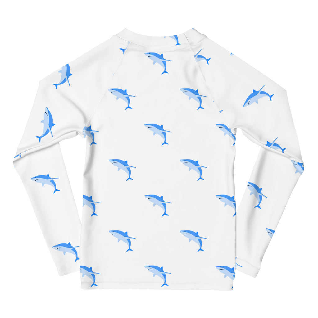 White long-sleeved kids shark rash guard swim shirt with blue shark pattern and upf 50 plus sun protection