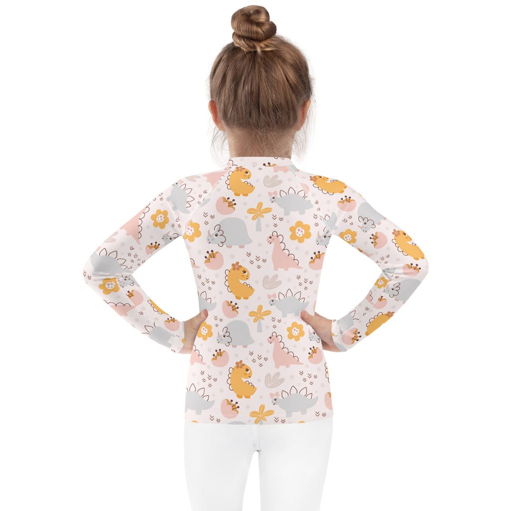 Girls floral dinosaur long sleeve rash guard swim shirt with upf 50 plus featuring pastel dinosaur and flower pattern on light background