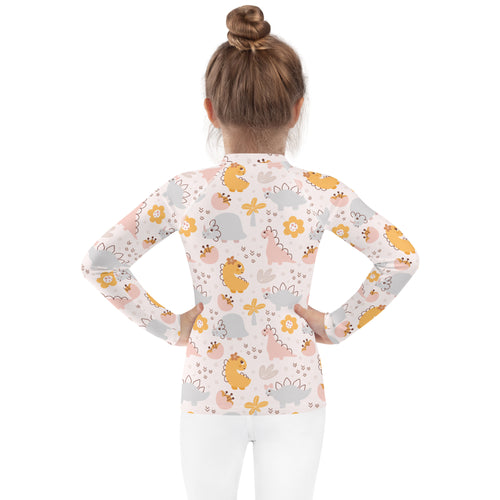 Girls floral dinosaur long sleeve rash guard swim shirt with upf 50 plus featuring pastel dinosaur and flower pattern on light background