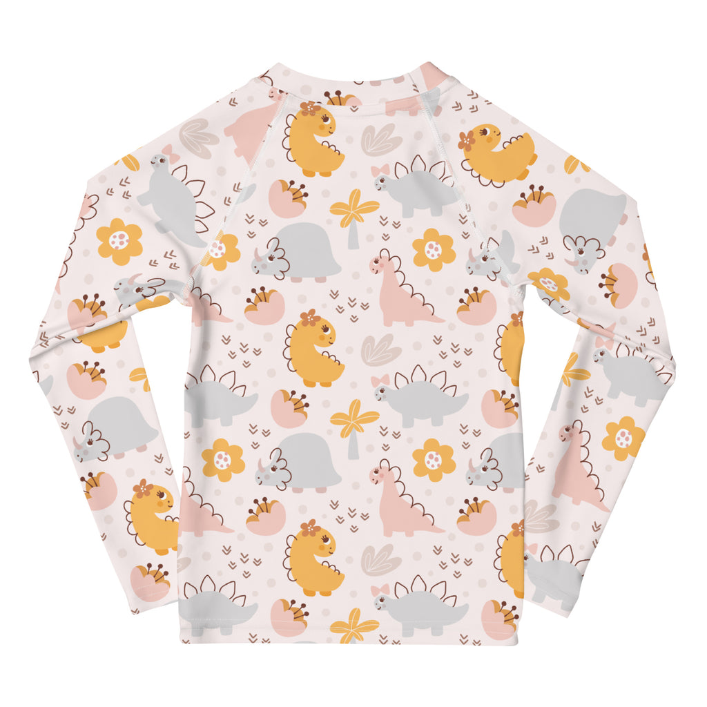 Girls floral dinosaur long sleeve rash guard swim shirt with UPF 50 featuring yellow pink gray dinosaurs and orange flowers on light background
