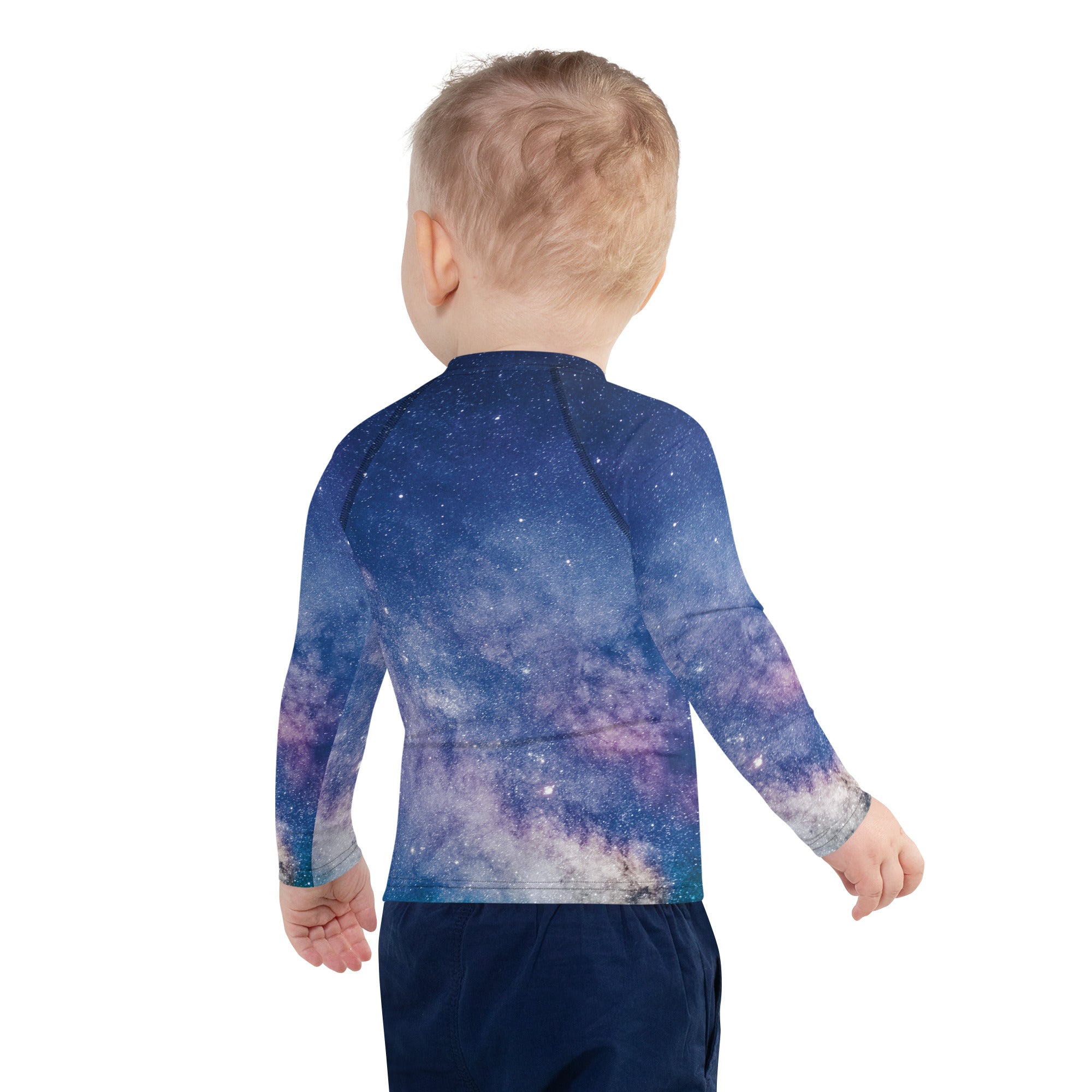 A child wearing a girls realistic galaxy long sleeve rash guard swim shirt with vibrant cosmic print and upf 50+ protection