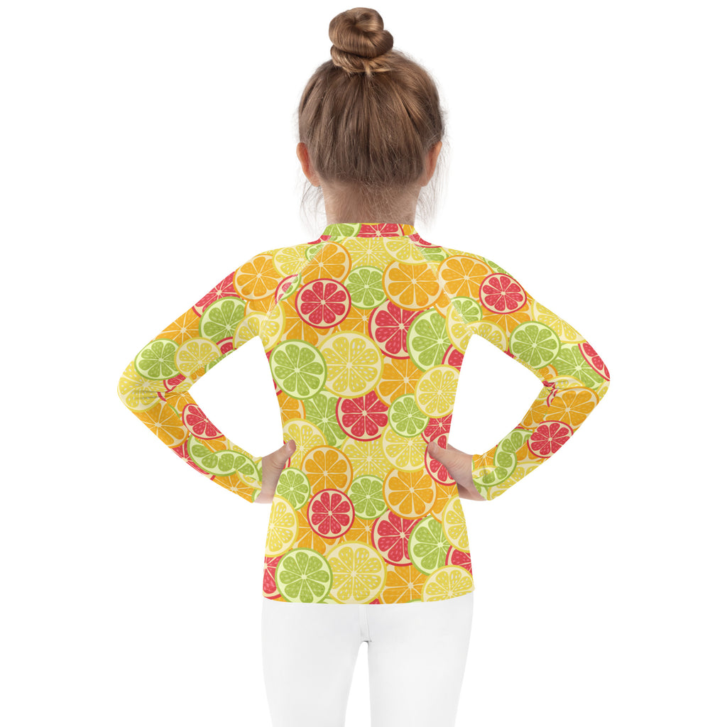 Kids citrus fruit long sleeve rash guard swim shirt with upf 50 plus featuring bright sliced citrus fruit pattern