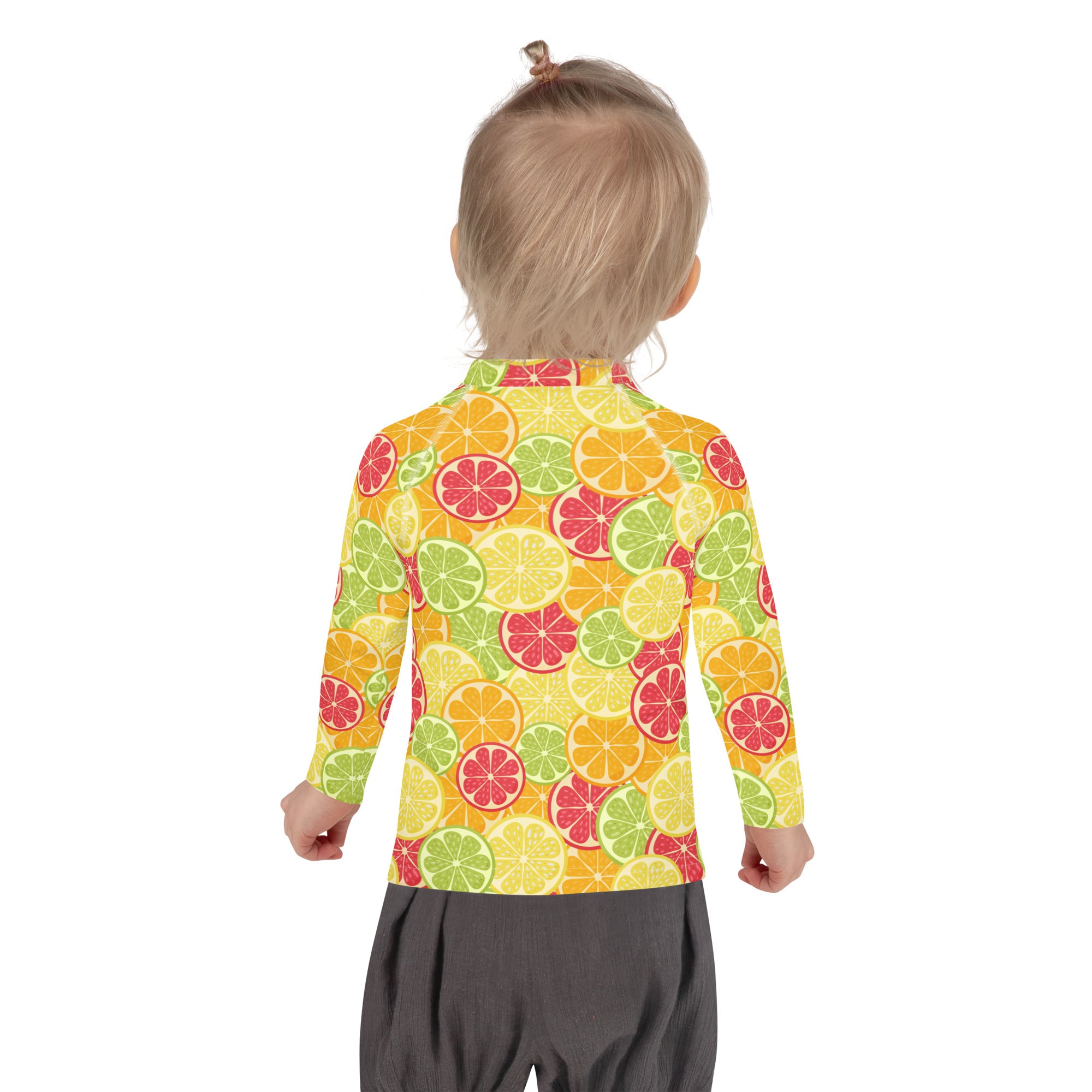 A kids long sleeve rash guard swim shirt with upf 50 plus featuring a vibrant citrus fruit pattern on orange