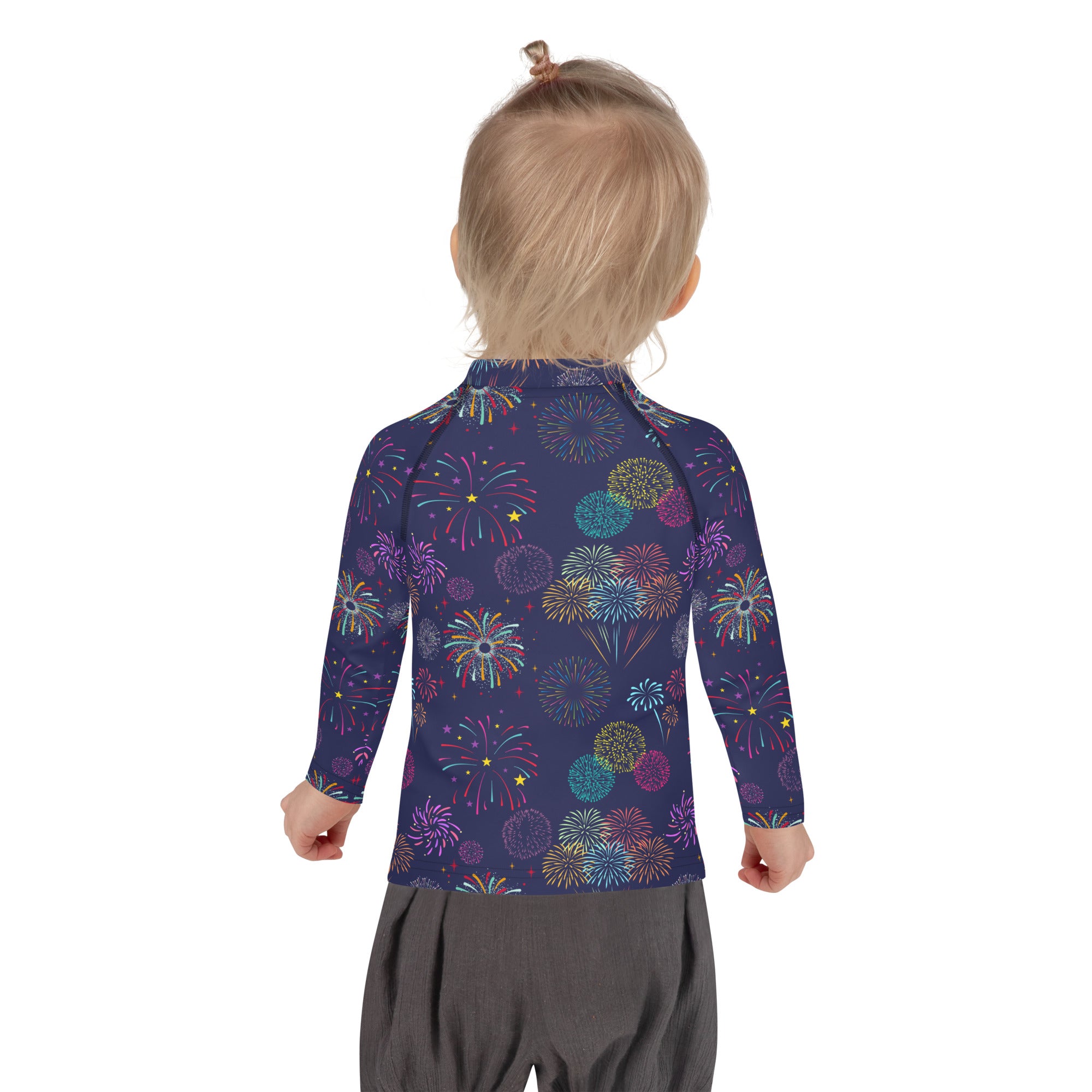 A child wearing a navy blue kids fireworks long sleeve rash guard with vibrant patterns and upf 50 plus protection