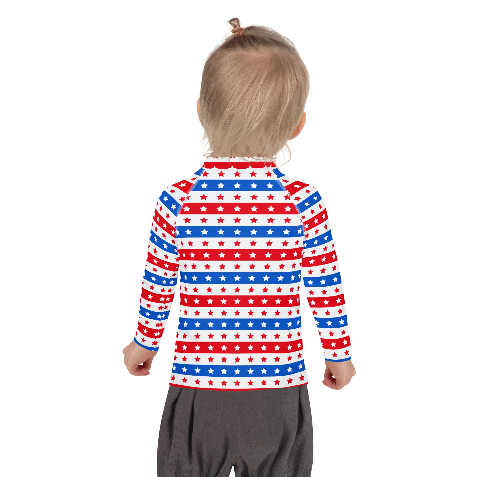 A child wearing a kids red white and blue stars and stripes usa long sleeve rash guard swim shirt with upf 50+