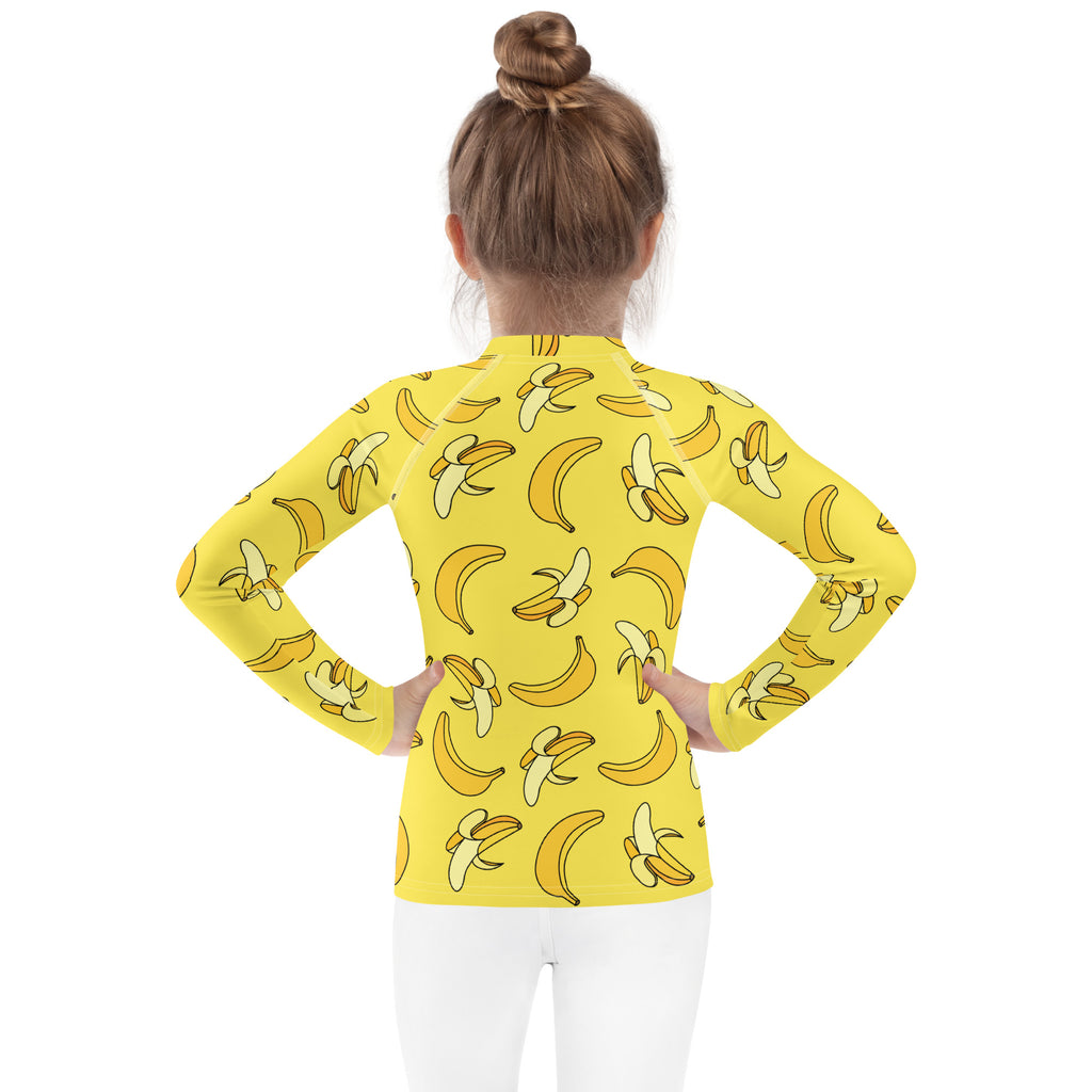 Kids yellow long sleeve rash guard swim shirt with playful banana pattern and upf 50 plus sun protection