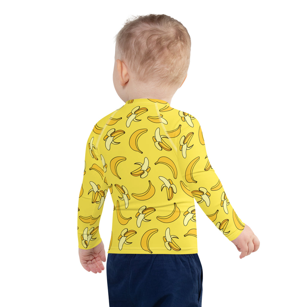 Kids banana long sleeve rash guard swim shirt in yellow with playful banana pattern and upf 50 plus sun protection