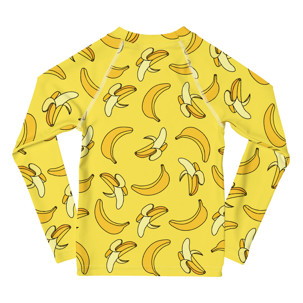 Yellow kids long sleeve rash guard swim shirt with playful cartoon banana pattern and UPF 50 plus sun protection