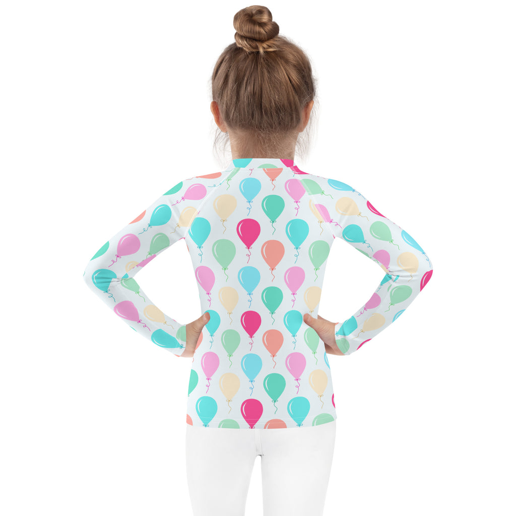 Kids birthday balloons long sleeve rash guard swim shirt in white with pastel balloon pattern and upf 50 plus protection