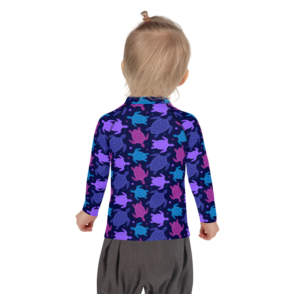 Girls purple sea turtle long sleeve rash guard swim shirt with UPF 50 plus featuring vibrant turtle pattern on navy