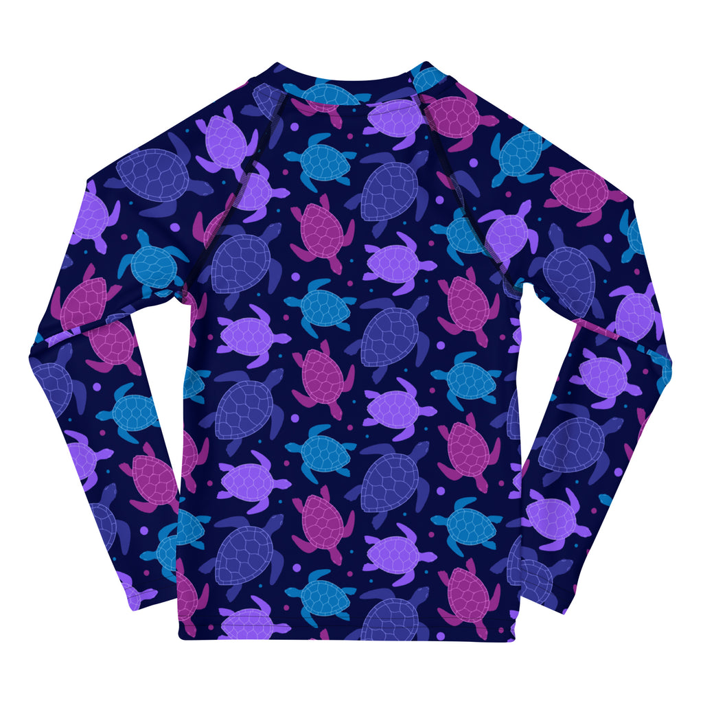 Girls purple sea turtle long sleeve rash guard swim shirt with vibrant sea turtle pattern and UPF 50 plus protection