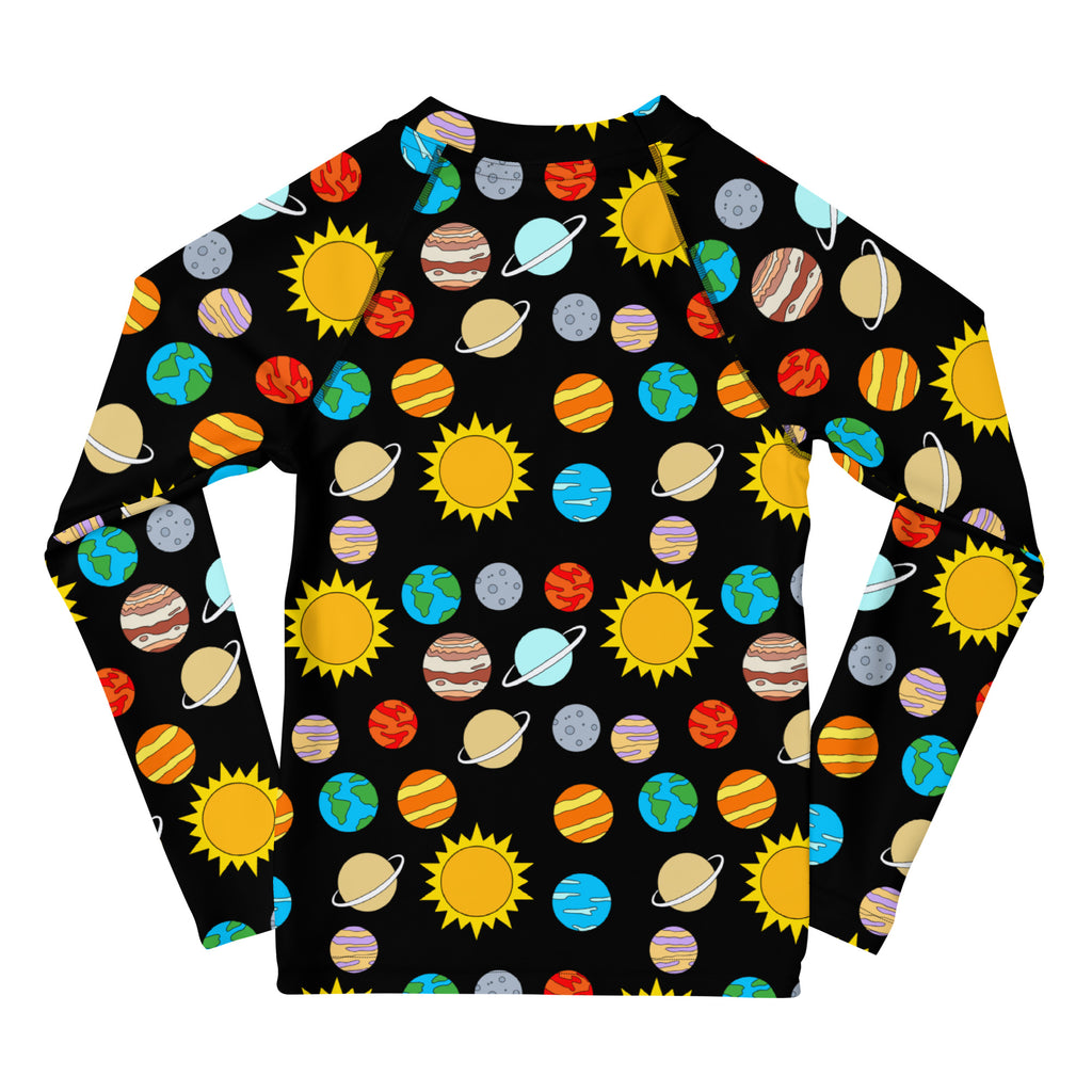 Black long sleeve rash guard for kids with vibrant cartoon planets and yellow suns featuring UPF 50 plus protection