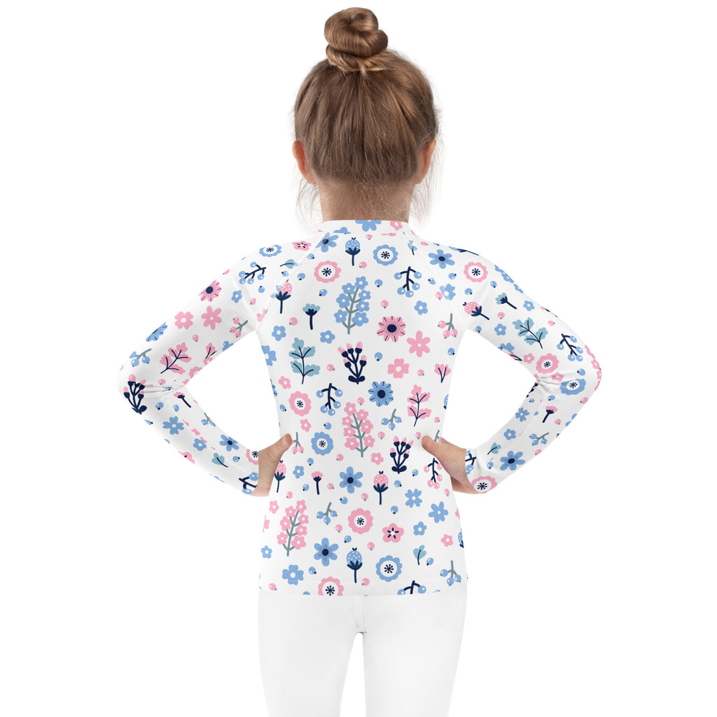 Girls pink and blue floral long sleeve rash guard swim shirt with upf 50+ featuring a white base and playful flowers