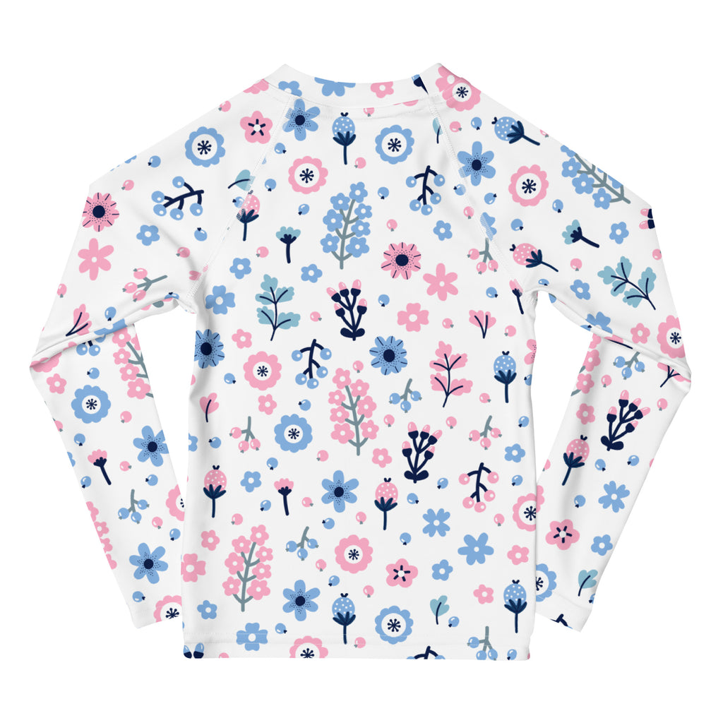 Girls pink and blue floral long sleeve rash guard swim shirt with upf 50 plus featuring white fabric and playful flower pattern
