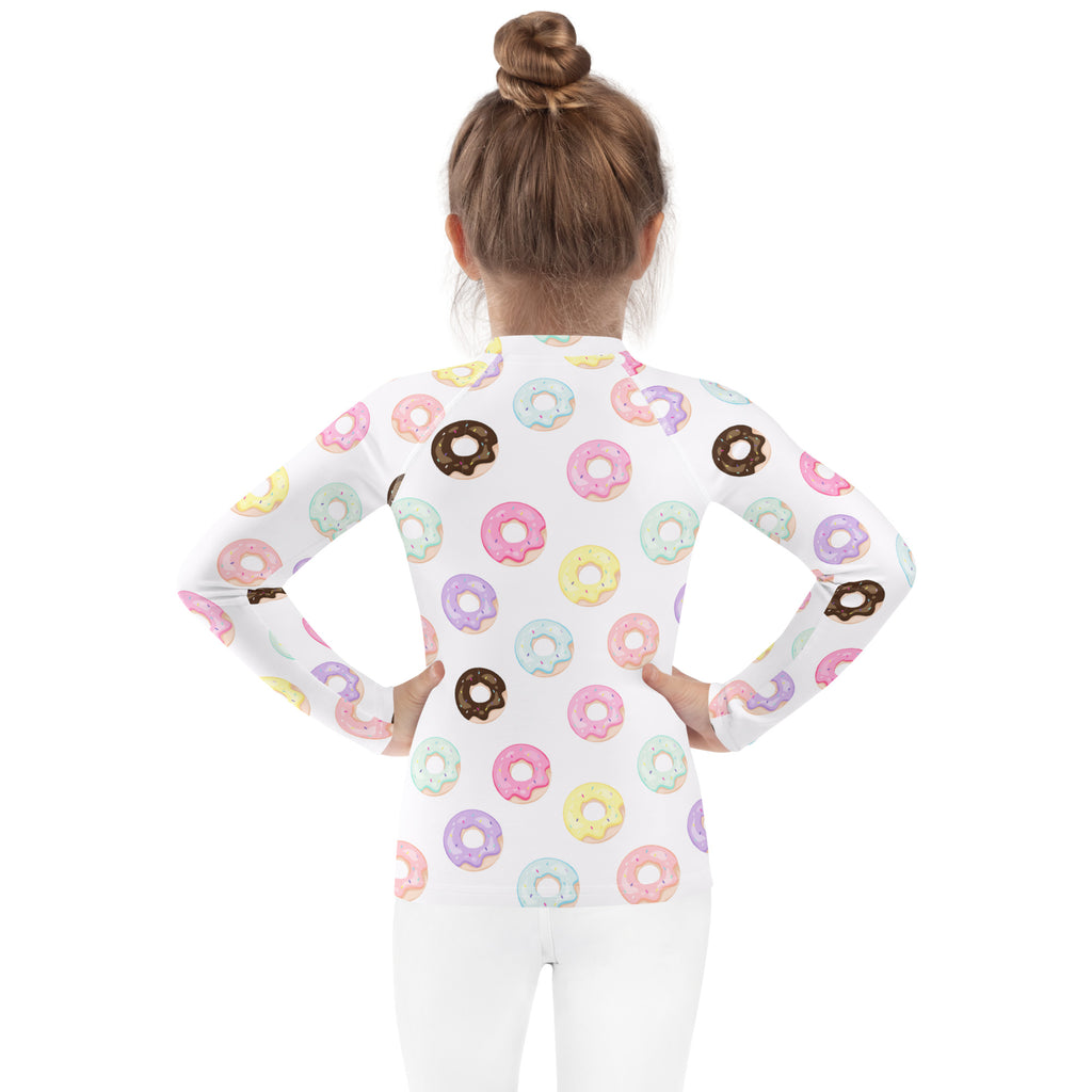 Kids colorful donuts long sleeve rash guard swim shirt in white with pastel donut pattern and UPF 50 plus protection