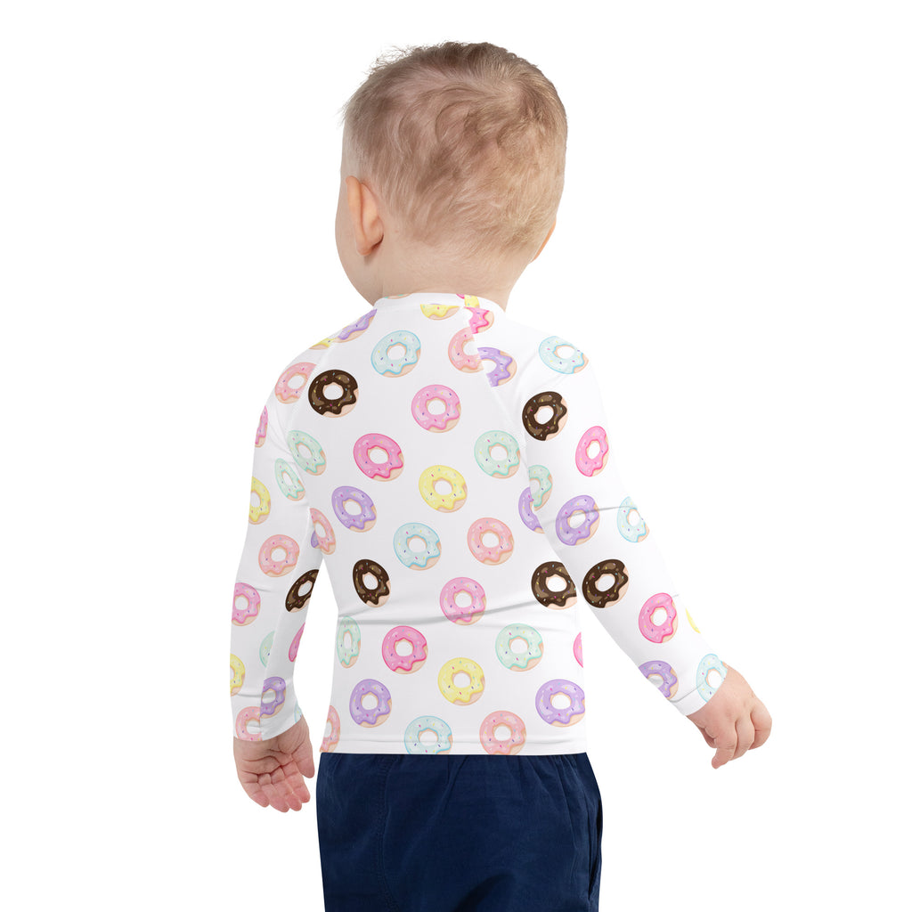 White long sleeve kids rash guard swim shirt with colorful pastel and chocolate donut pattern and UPF 50 plus protection