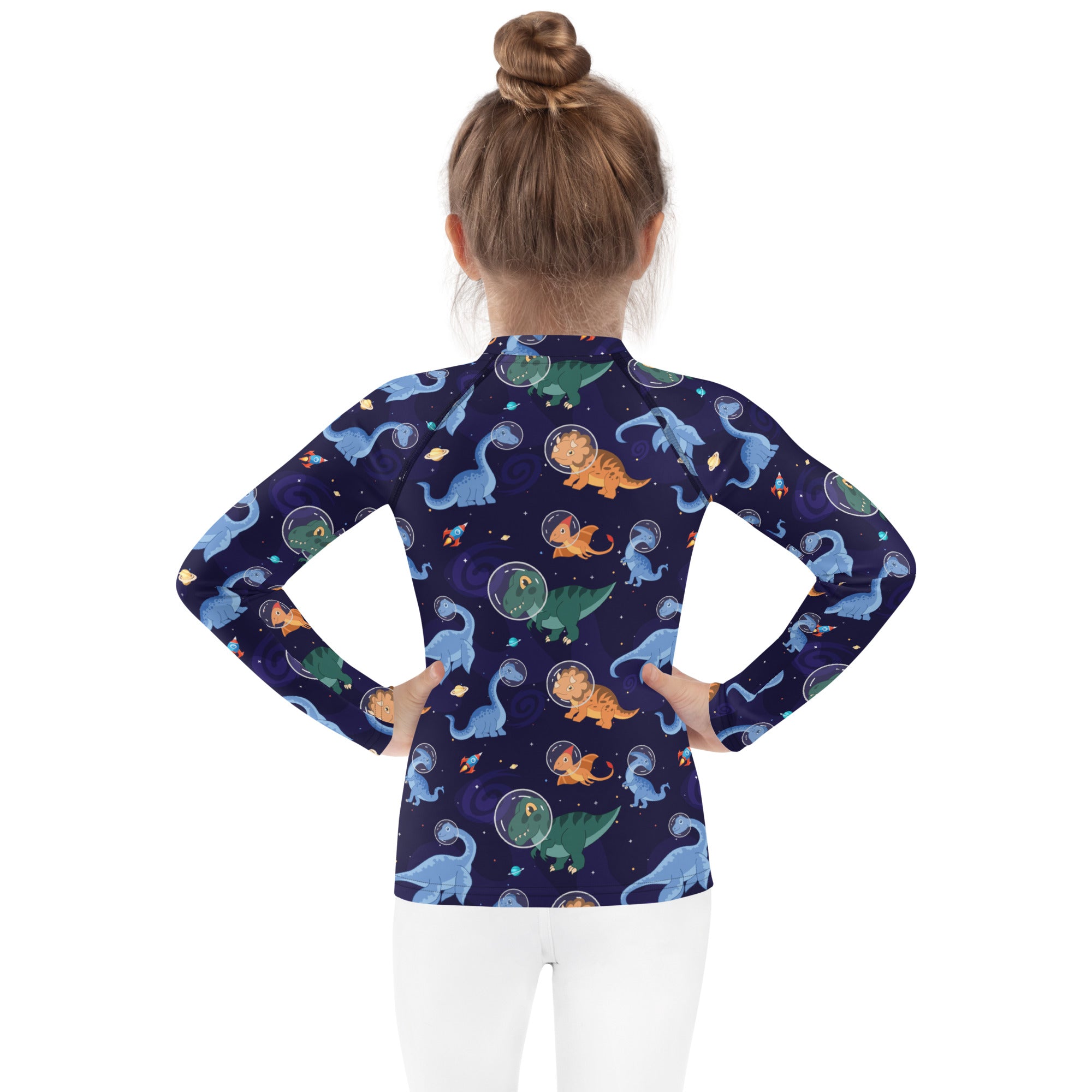 A navy blue kids long sleeve rash guard with UPF 50 plus featuring dinosaurs in astronaut helmets on a starry backdrop