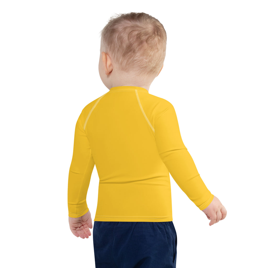 Kids yellow long sleeve rash guard swim shirt with subtle white seams and upf 50 plus sun protection