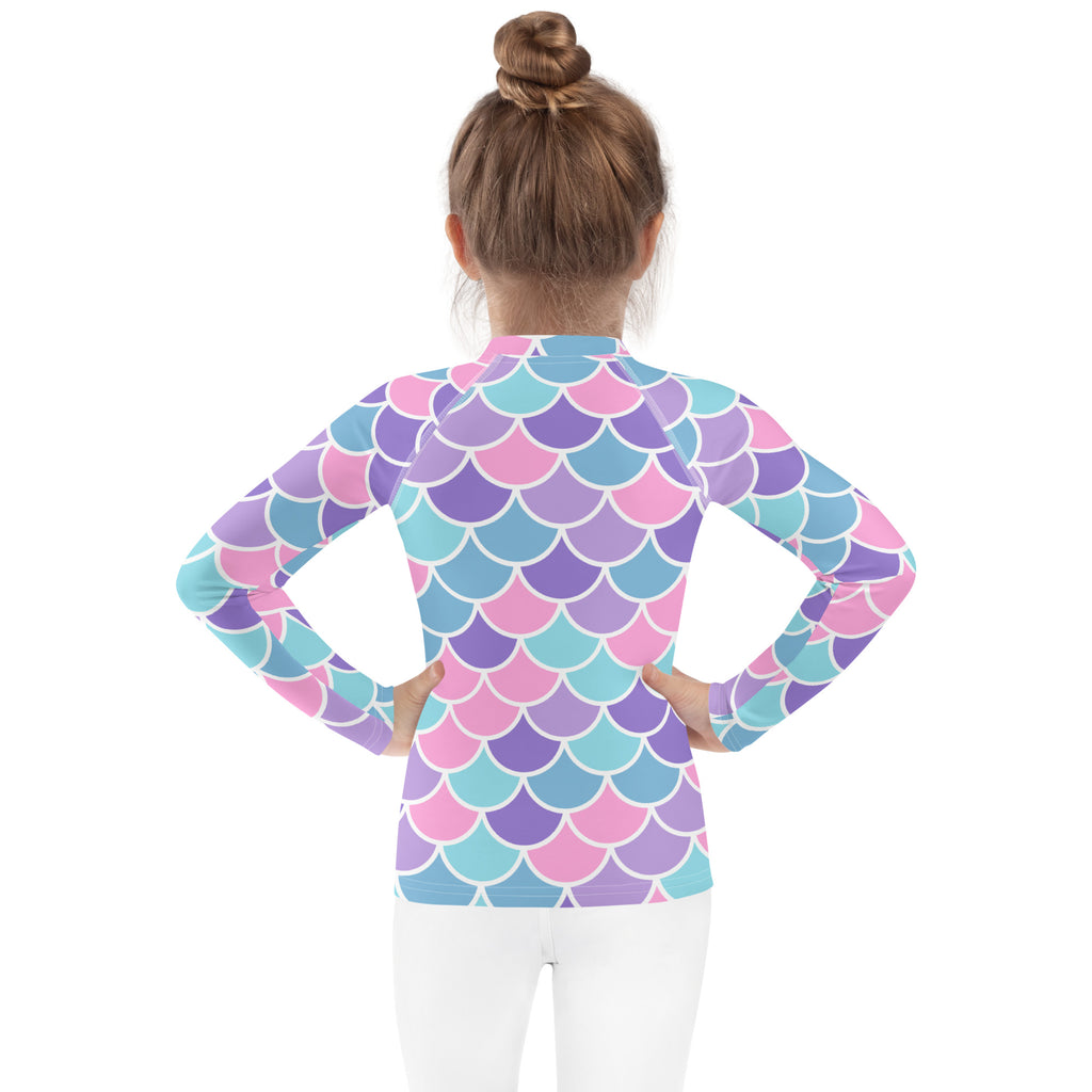Girls pastel mermaid scales long sleeve rash guard swim shirt with vibrant pastel pink purple teal scale pattern and UPF 50+
