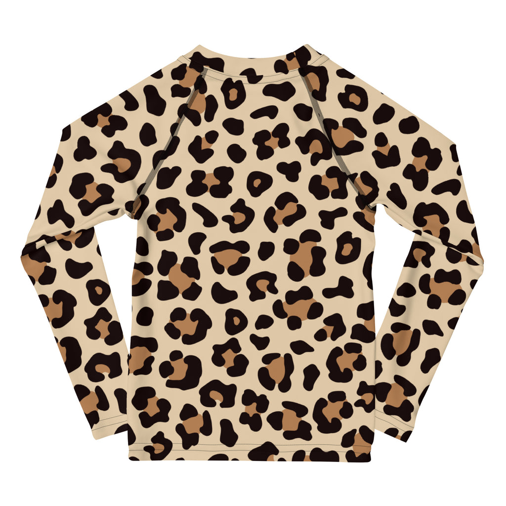 Beige kids long sleeve rash guard with bold black and tan leopard print pattern and upf 50 plus sun protection