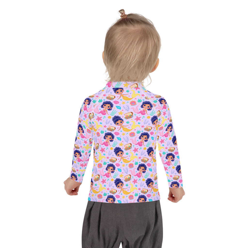 A child wearing a light purple girls mermaid adventure long sleeve rash guard swim shirt with UPF 50+ and mermaid print